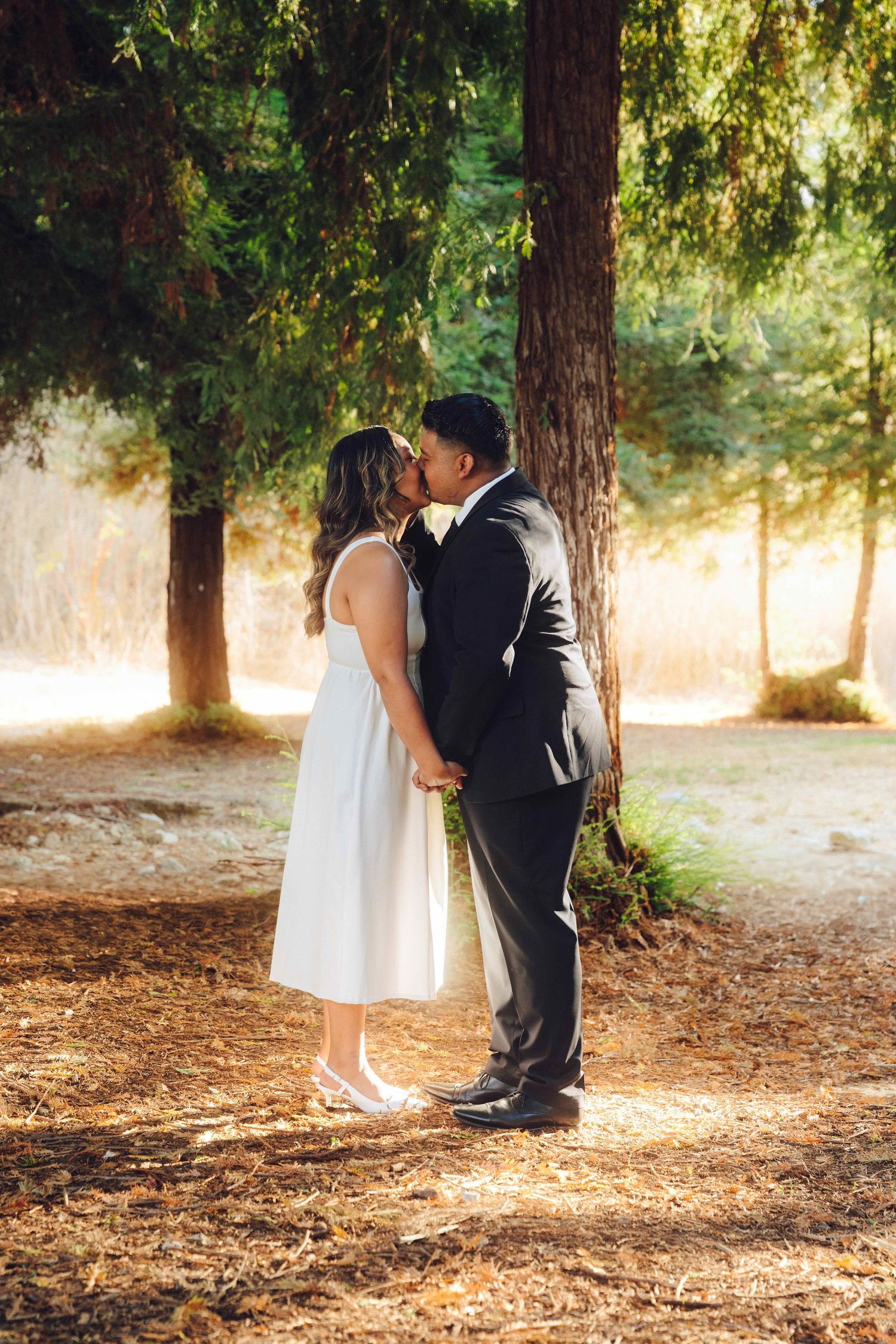 Candid moment of couple enjoying engagement photos in Orange County