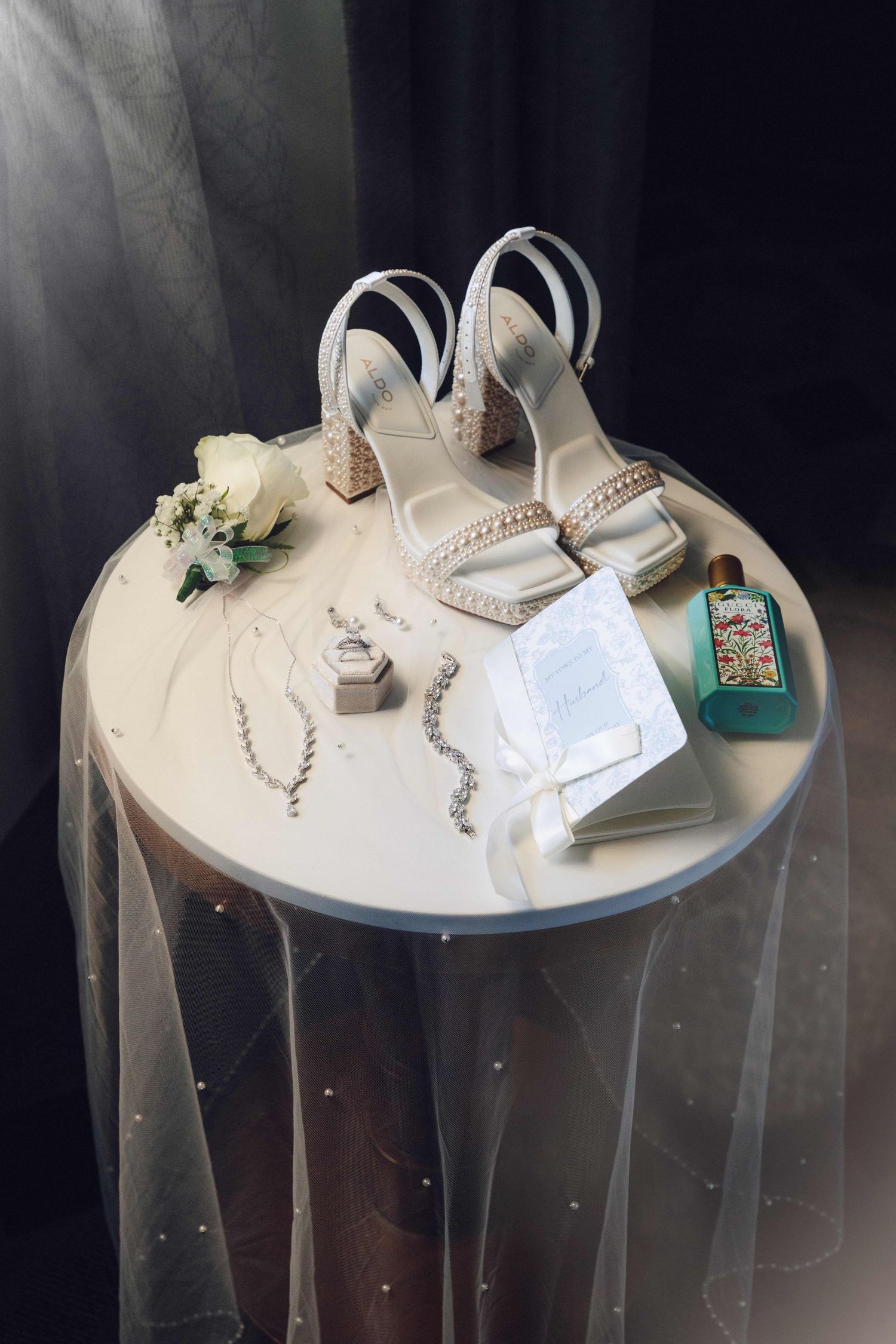 Brides wedding details arranged on a small white round table