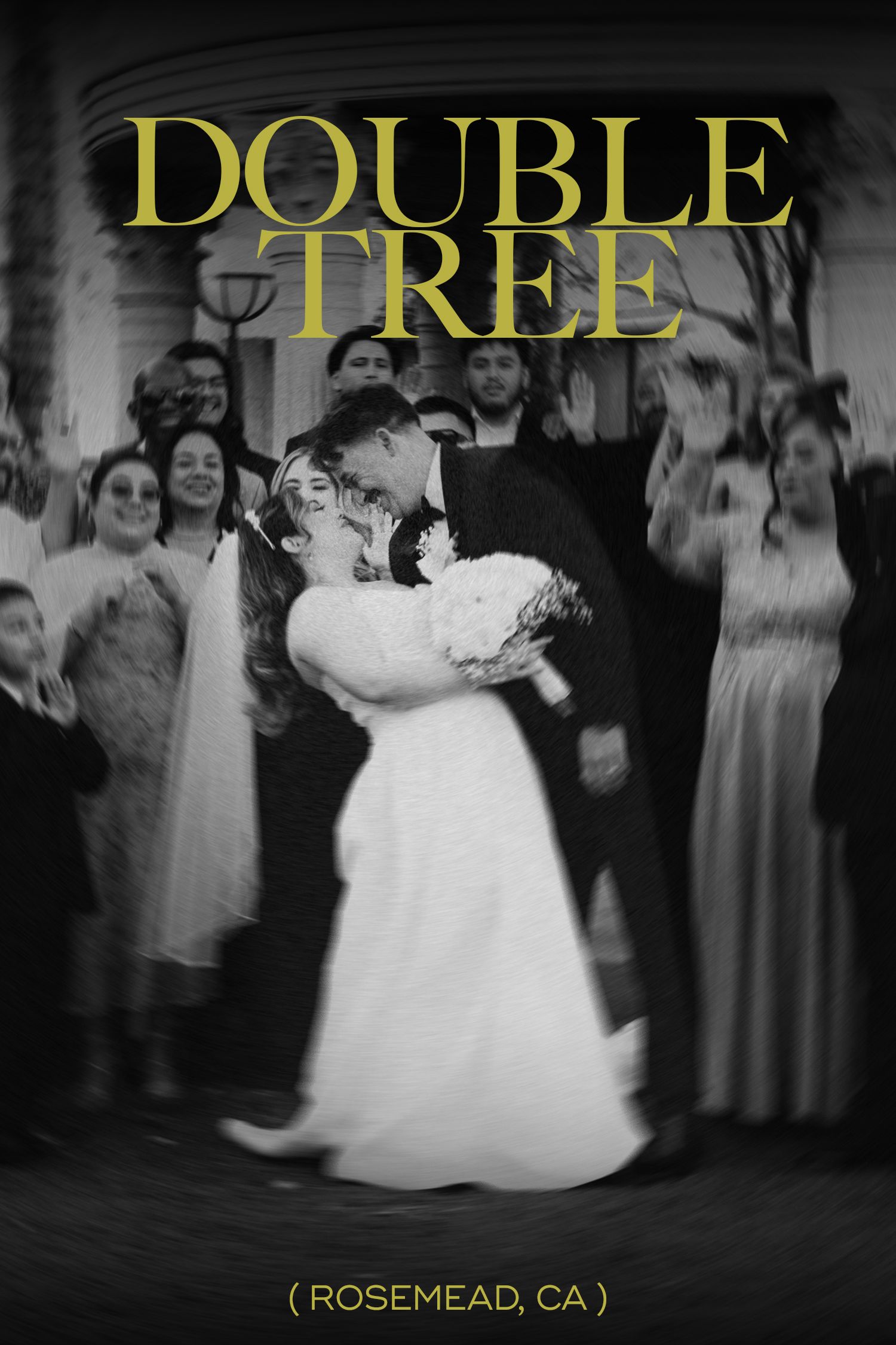 double tree by hilton in rosemead with the married couple giving a kiss while the family and friends are around them cheering them