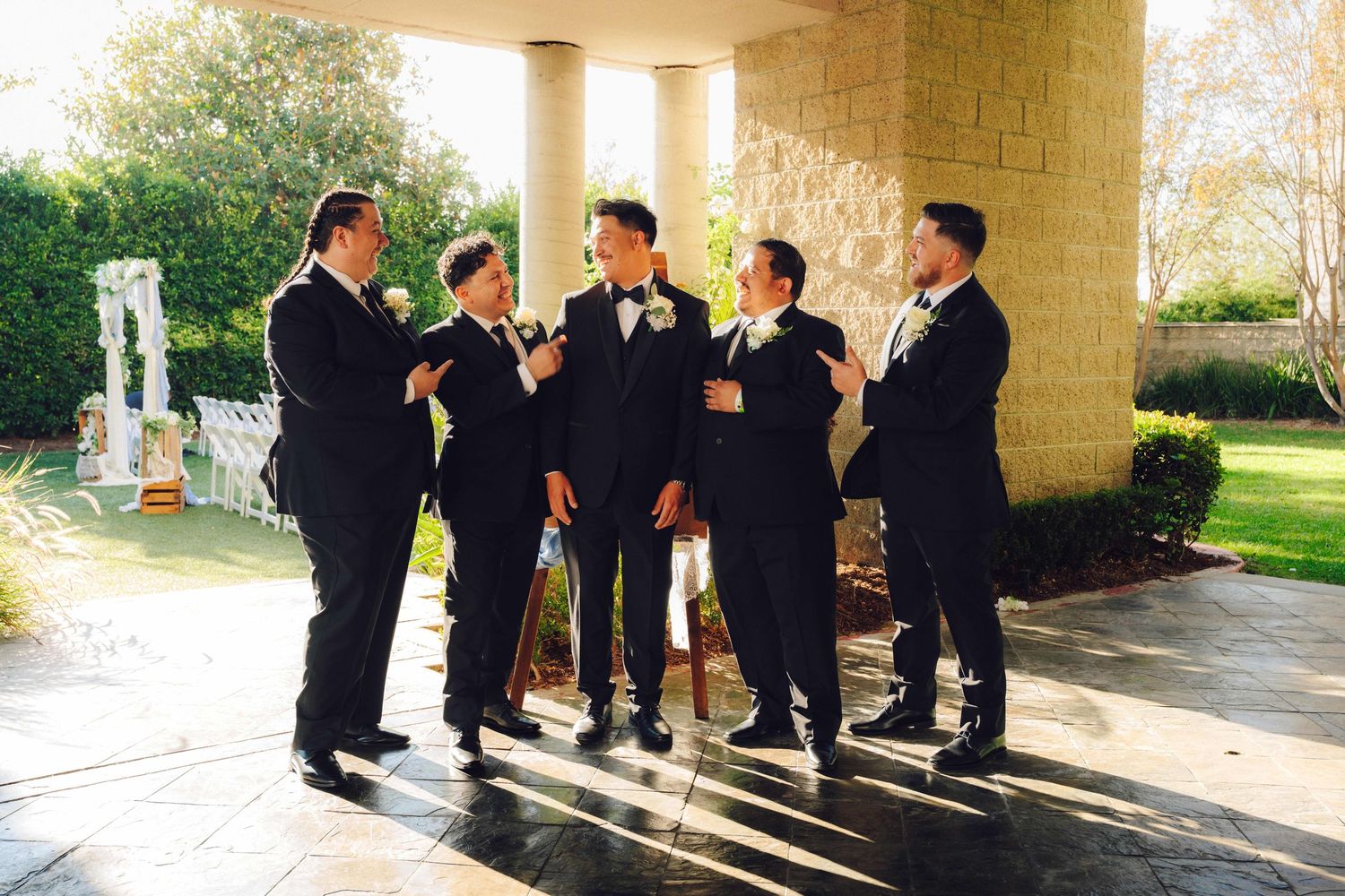 Groom with his friends laughing and having a good time