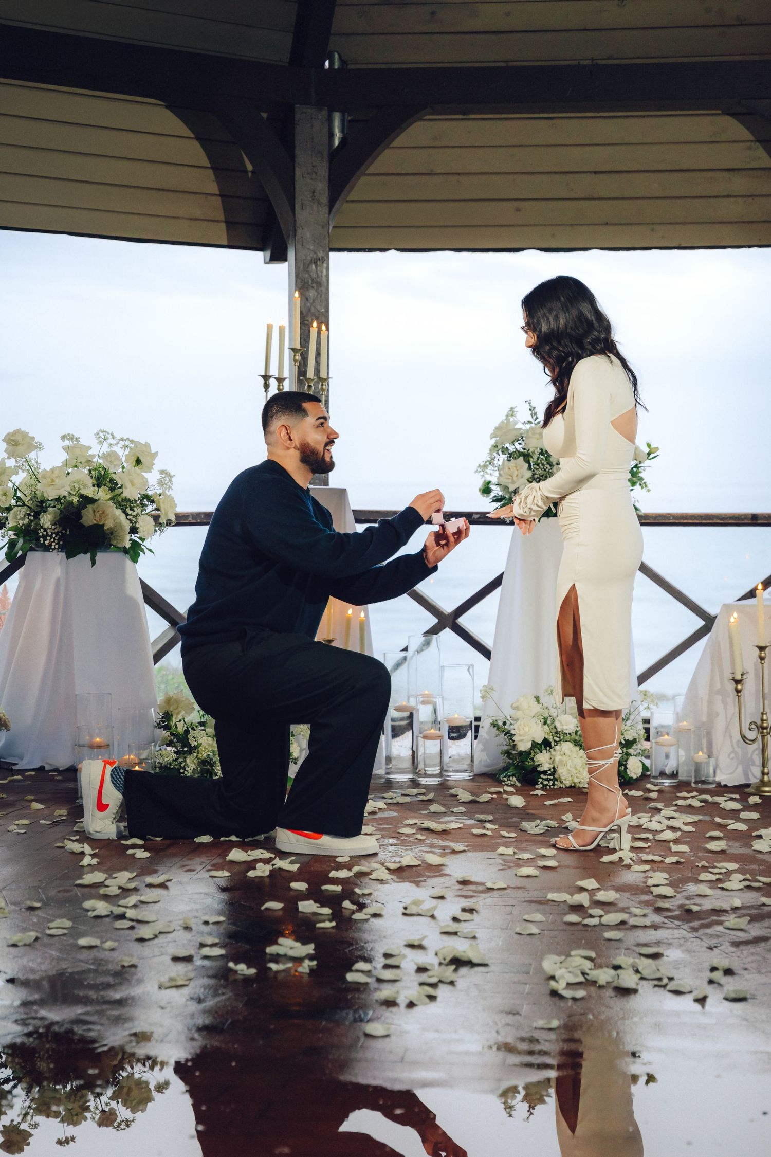 Man proposing at the gazebo in Heisler park with the ocean view
