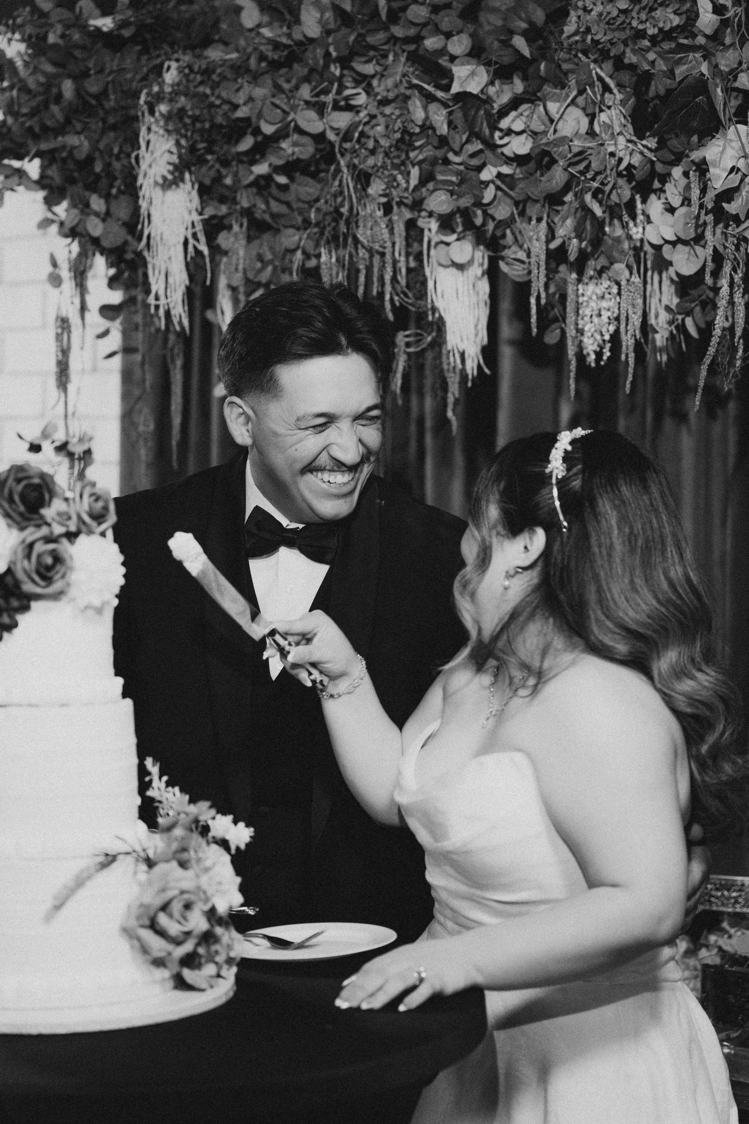 Couple cutting the wedding cake at DoubleTree Rosemead reception