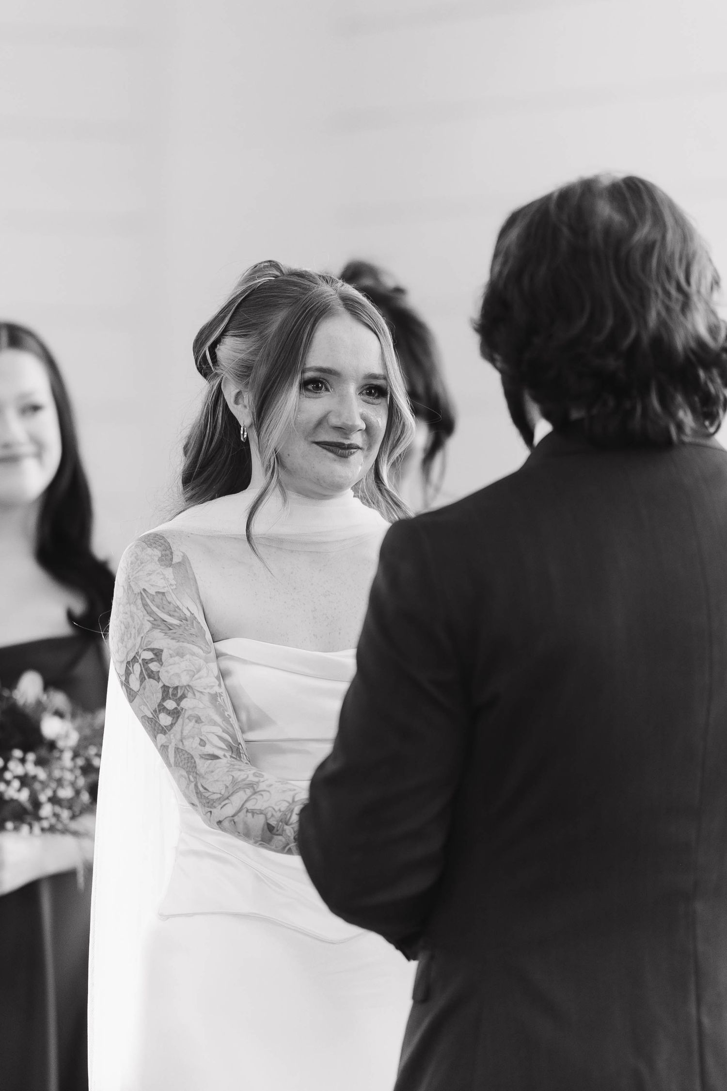 Black and white photo sequence showing tender first dance moments at a wedding reception with the bride in white dress.