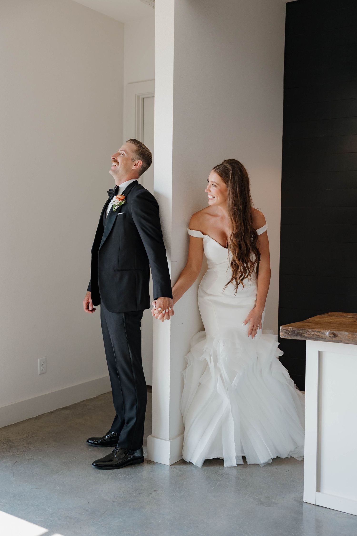 A creative sequence of wedding photos showing playful moments between a couple peeking around white pillars.