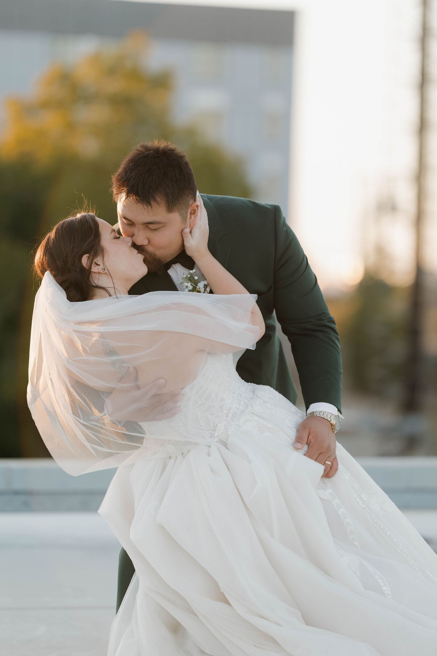 Series of romantic wedding photos showing newlyweds in tender moments with flowing white wedding dress against sunset.