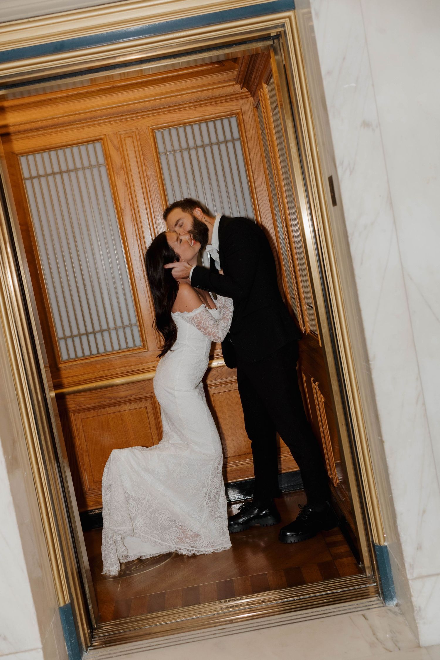A series of intimate dance moments between a couple in formal attire by wooden doors.