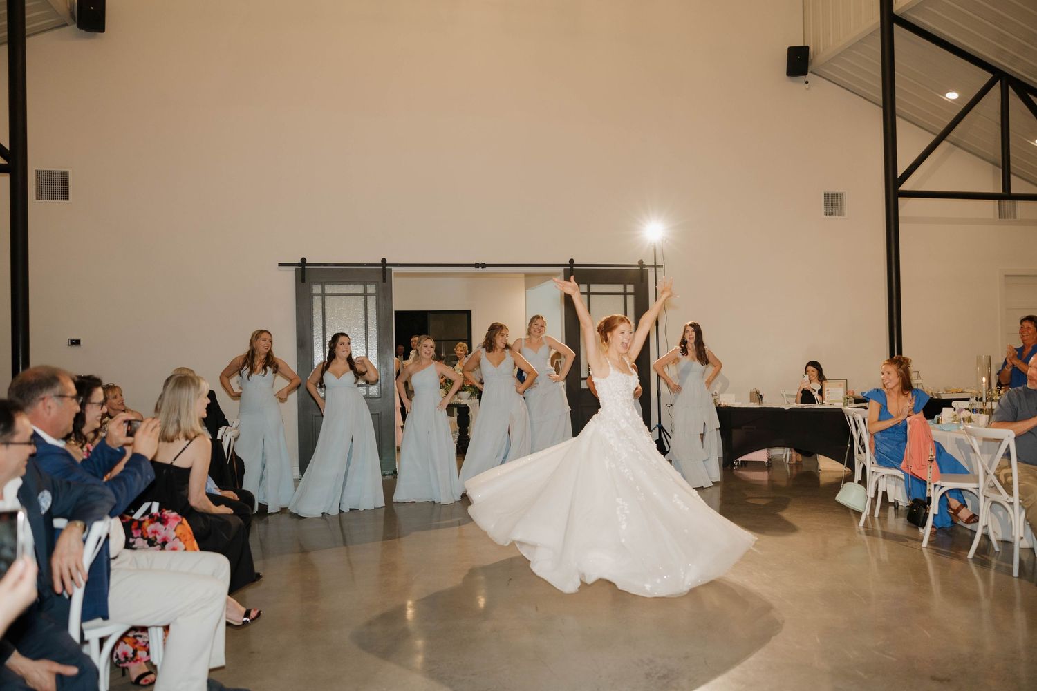 Panoramic sequence of a wedding reception venue showing a bride switching dance partners during a traditional dance.