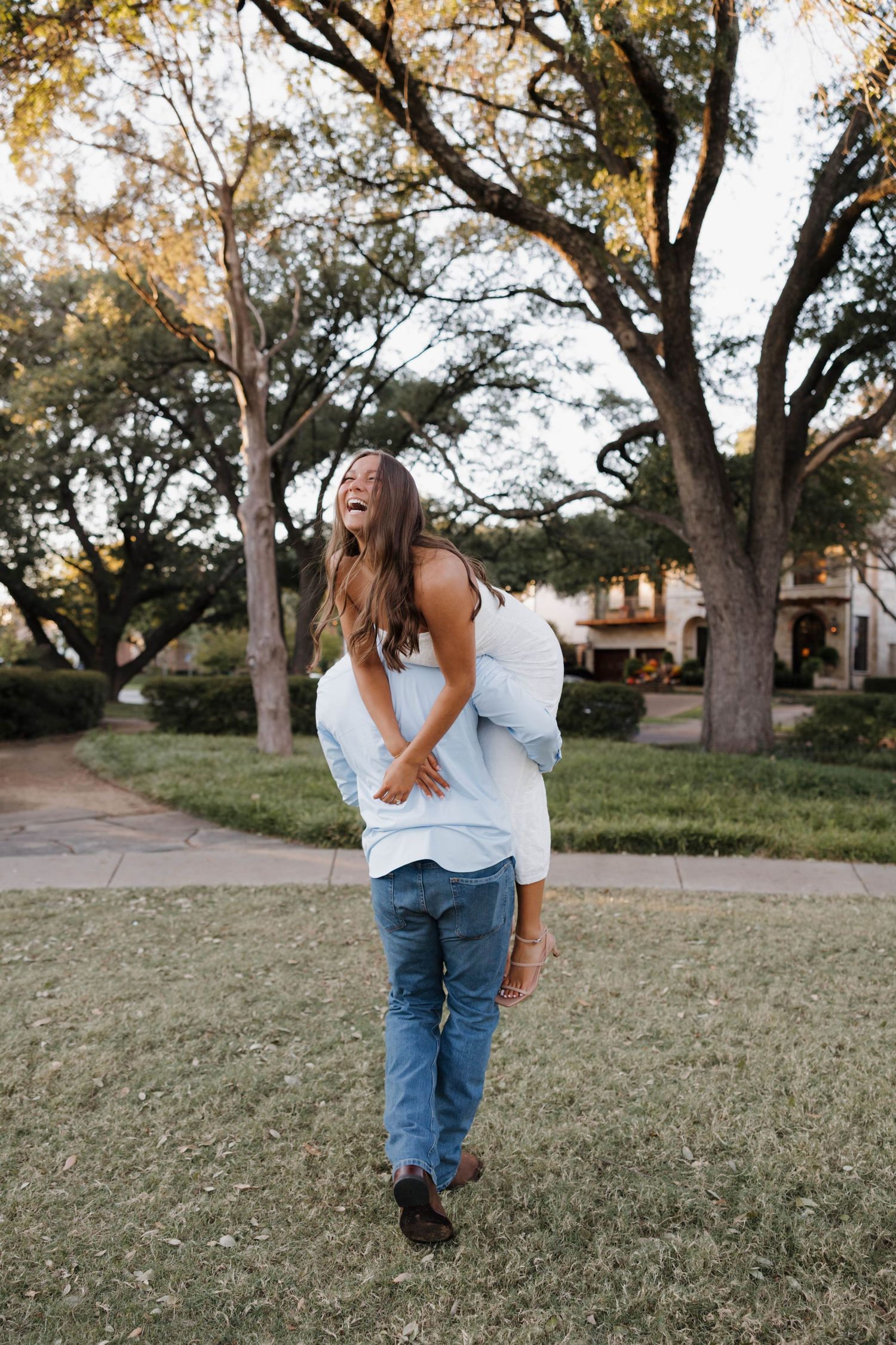 A series of candid outdoor portraits showing a person in jeans and white top posing playfully against a backdrop of mature trees.