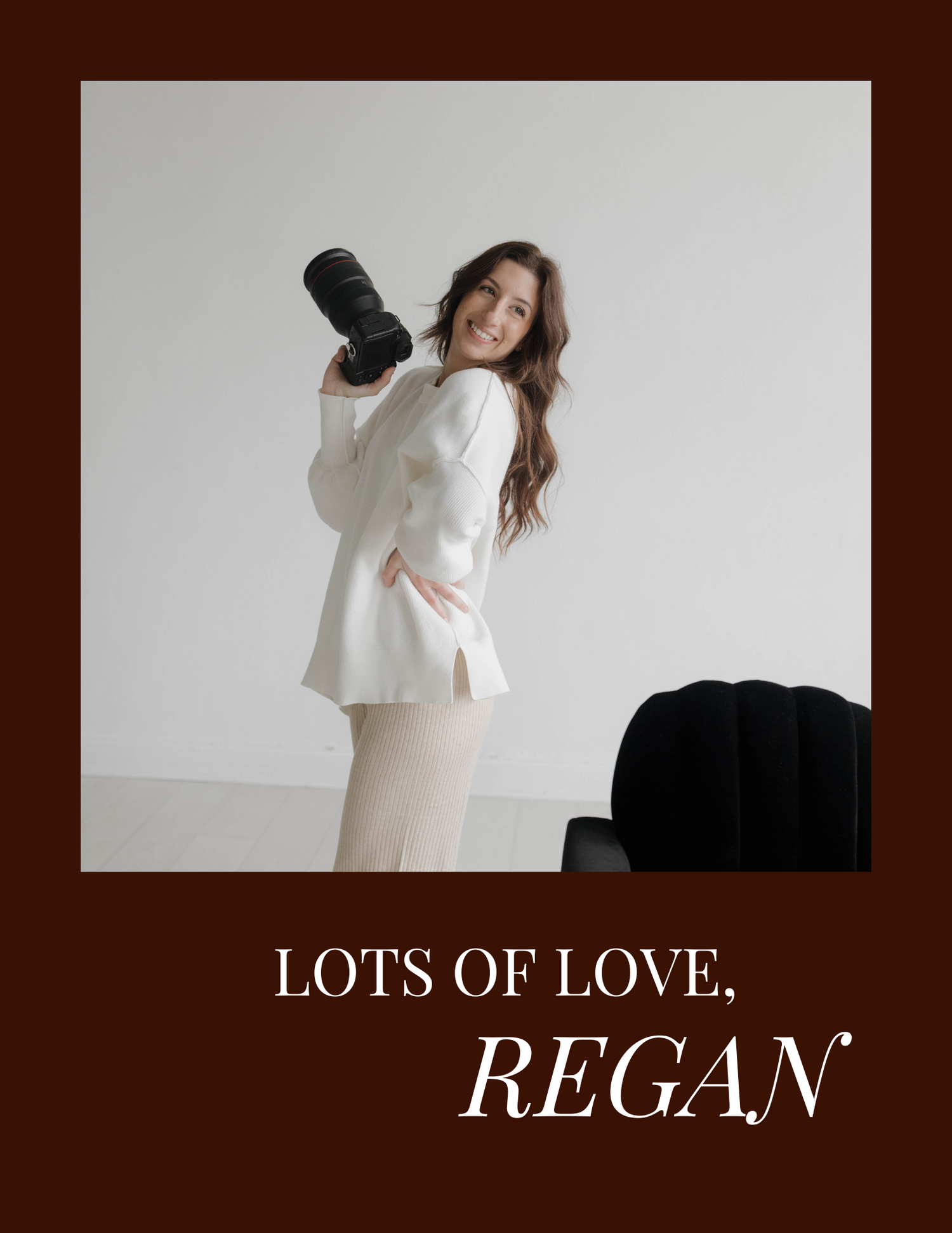 Professional photographer poses with camera equipment in white studio outfit.