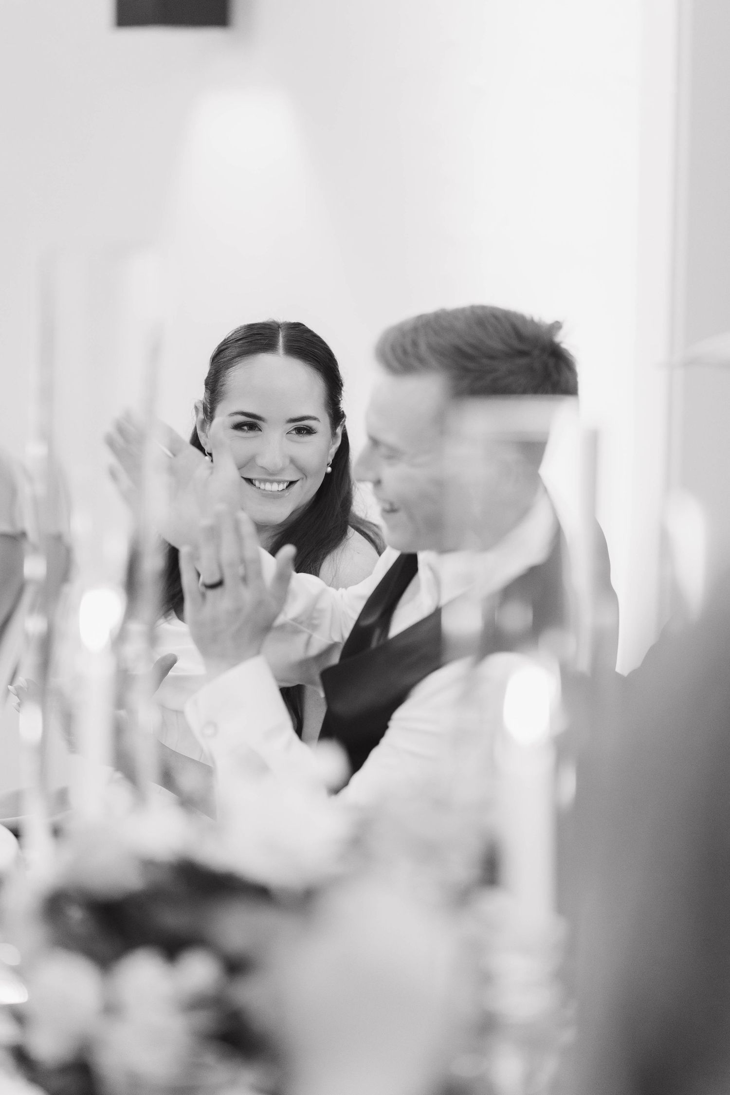 Professional colleagues having an animated discussion during a business meeting in a bright modern conference room.