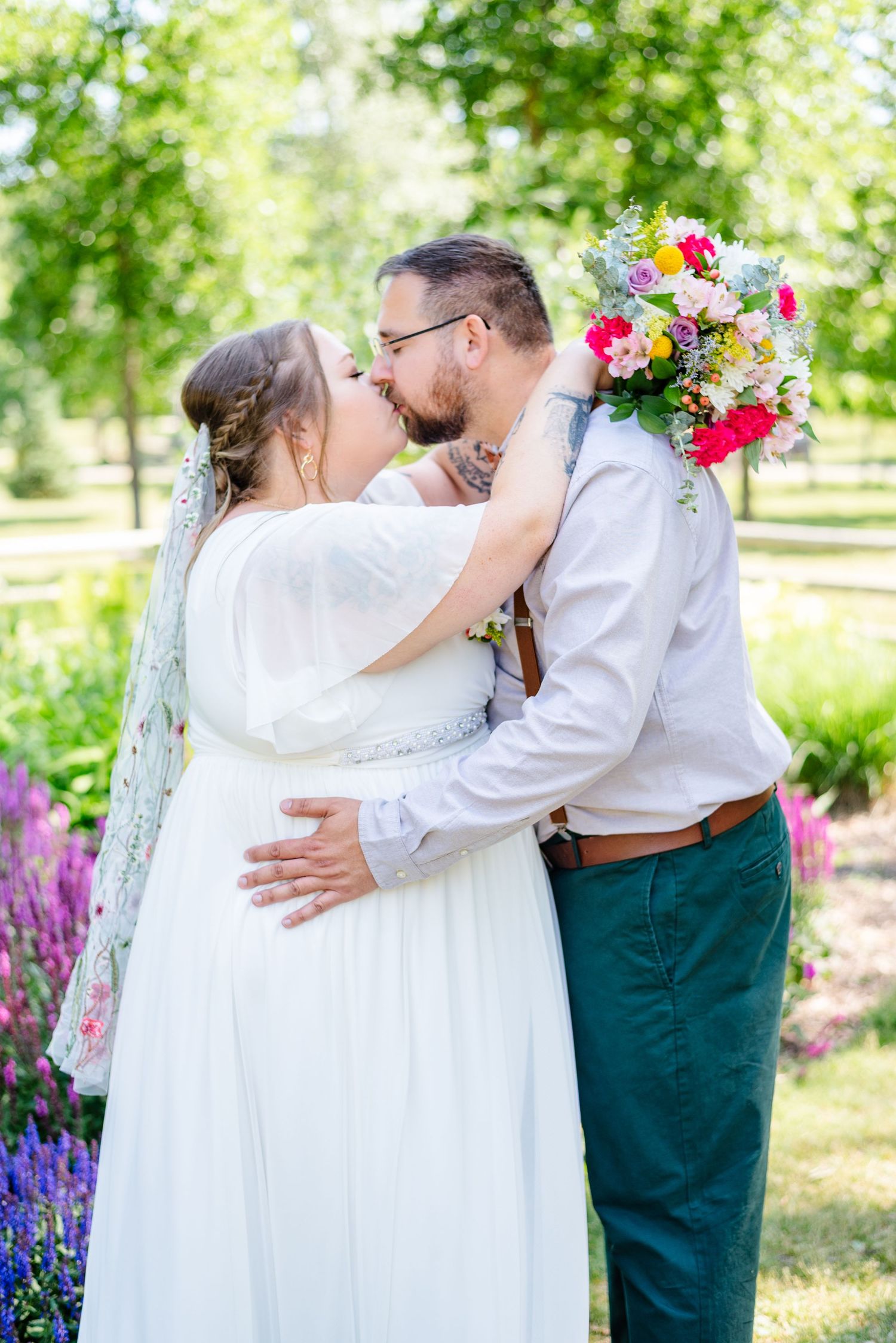 a bride and groom kiss