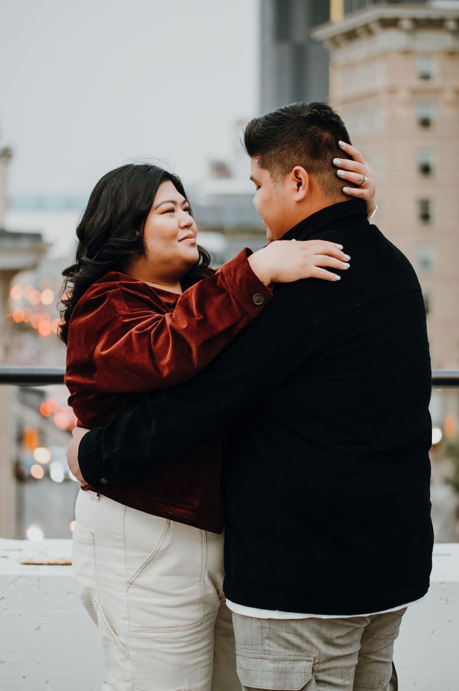 Couple look at eachother on rooftop