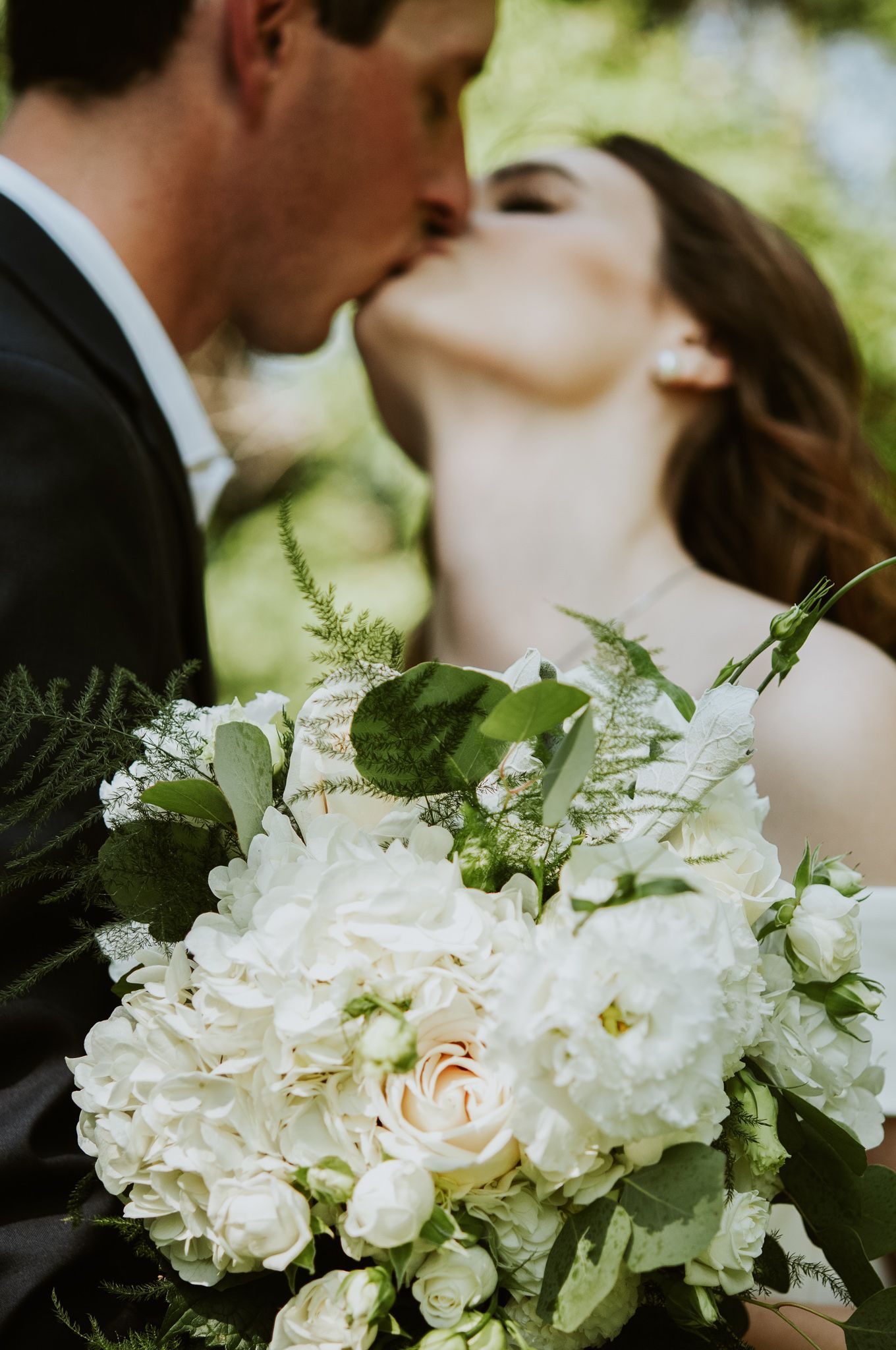 Couple kisses on wedding day