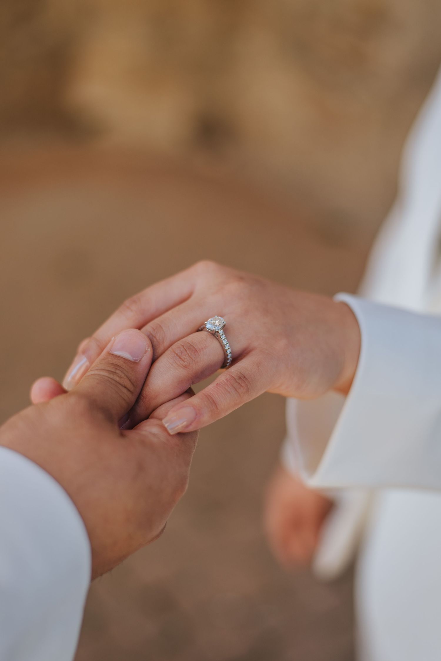 Man holds womans hand