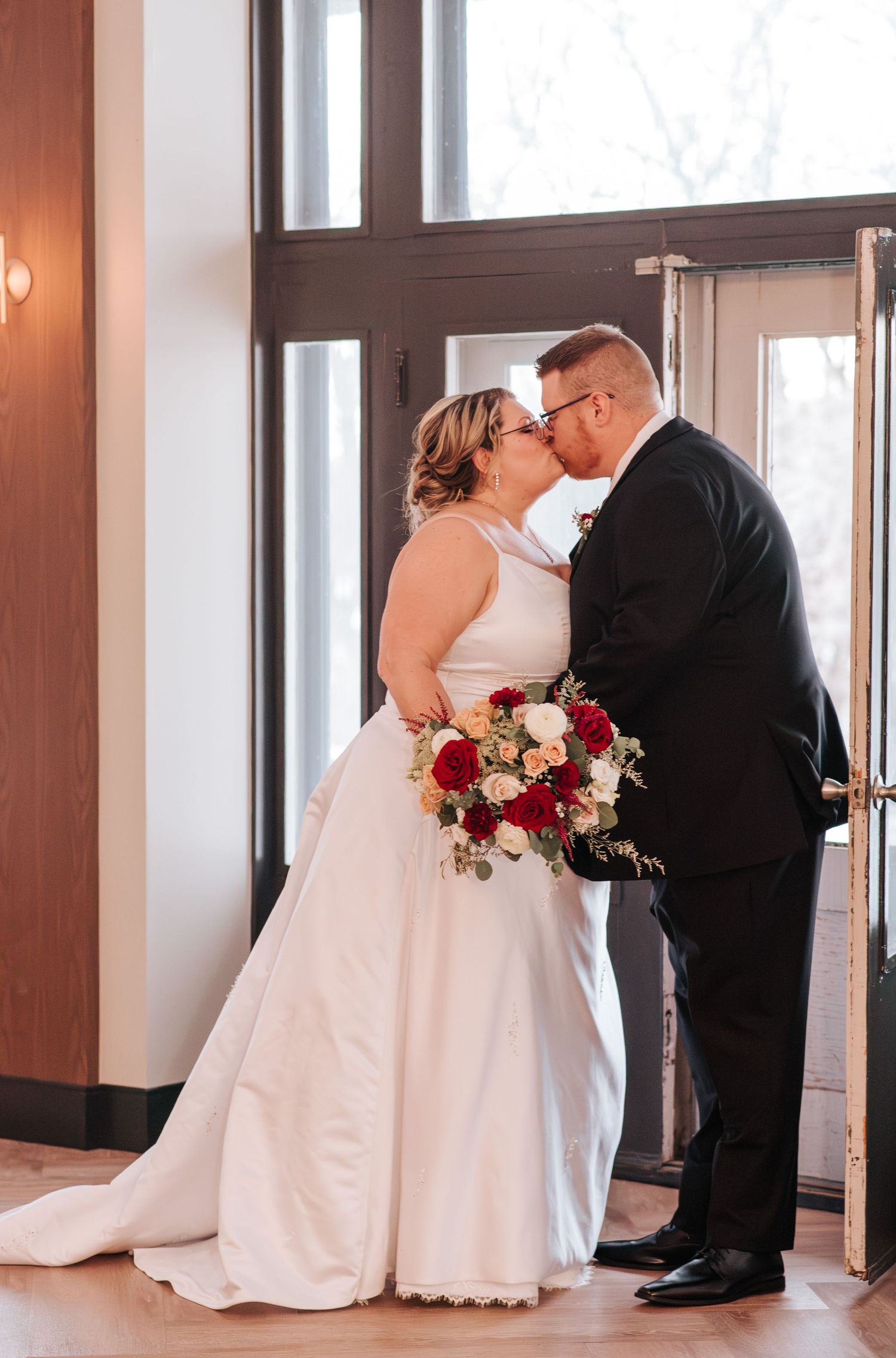 Couple kiss after wedding