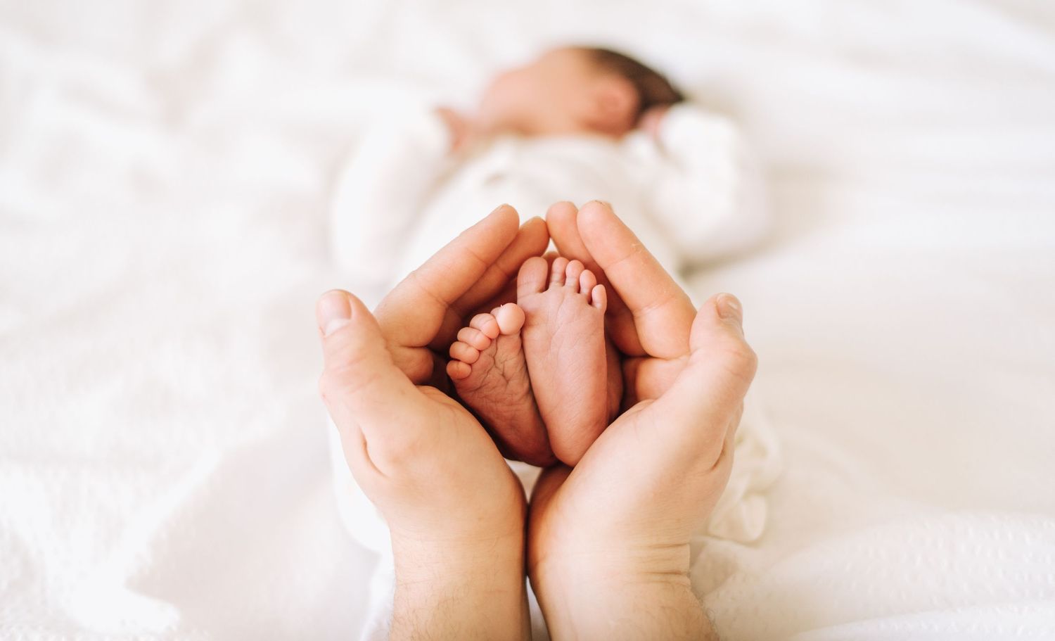 Mom holds babies feet