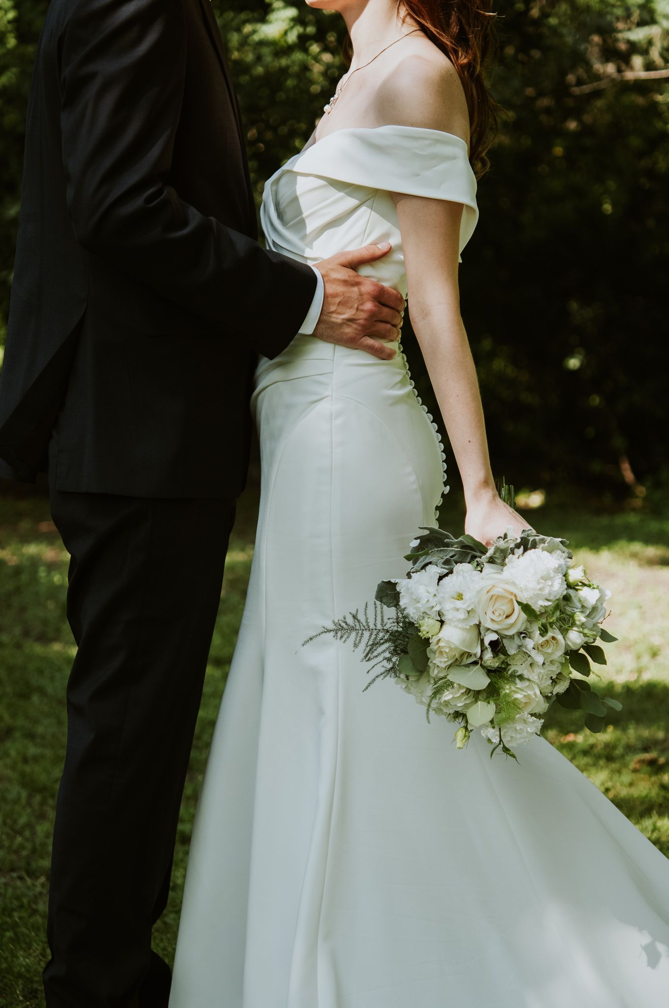 Couple embrace on wedding day