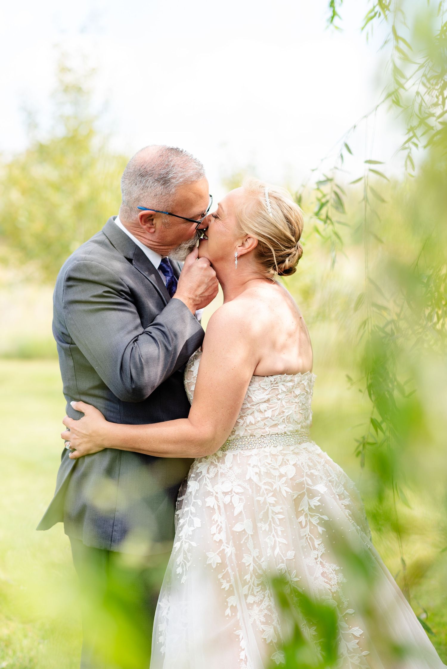 couple kiss on wedding day