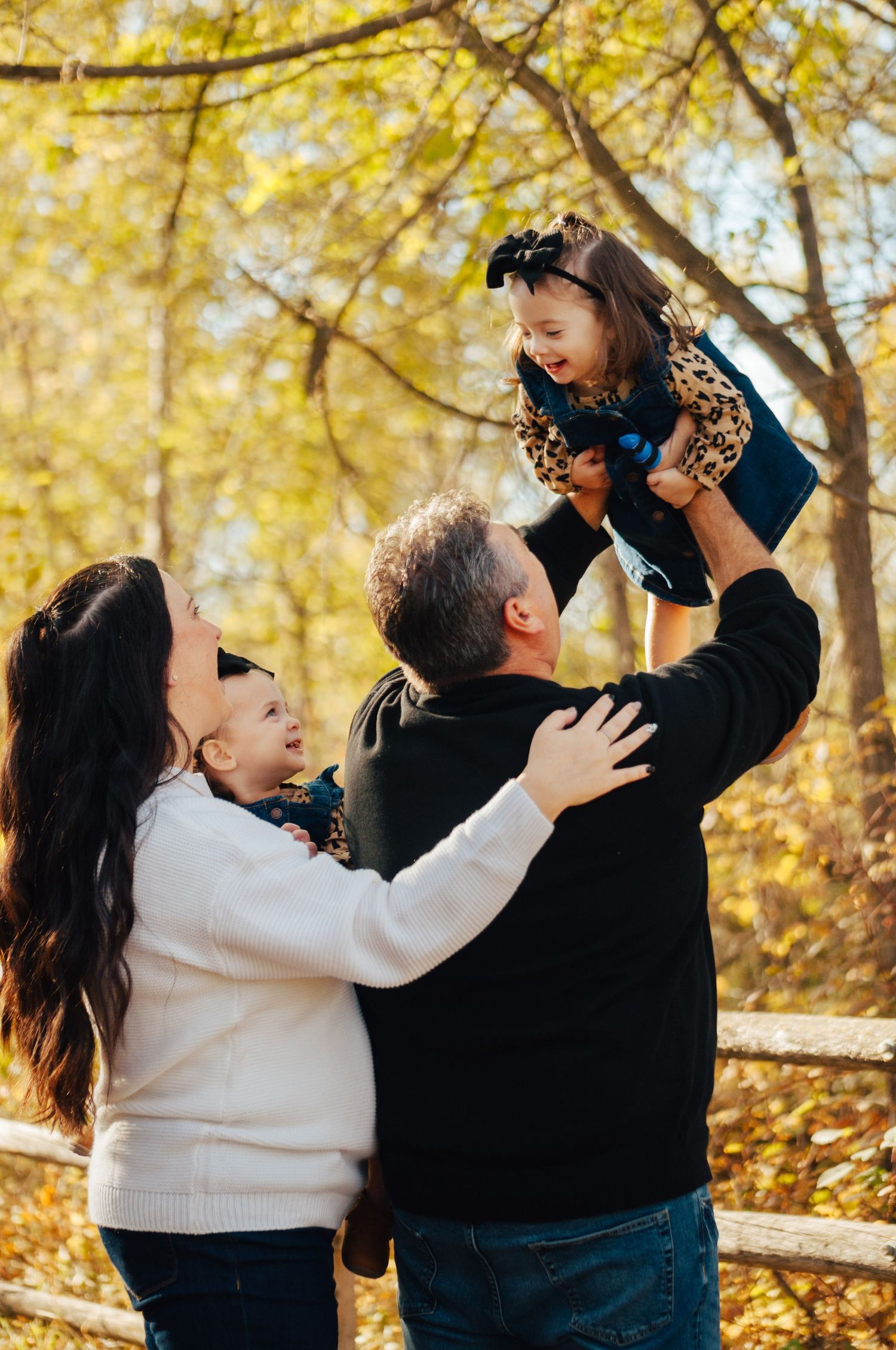 Family Playing in park in the fall