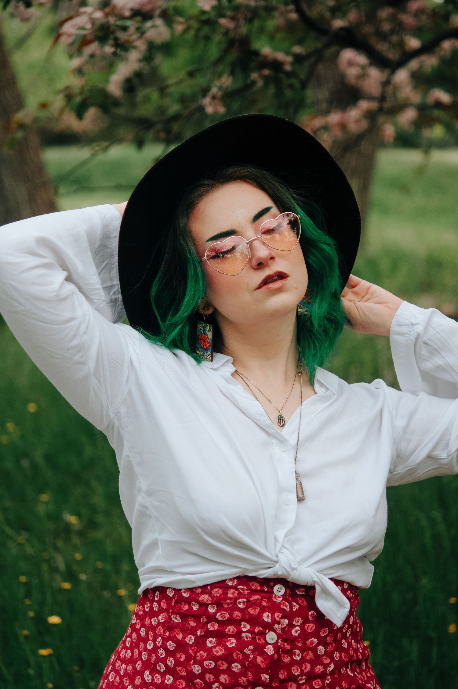 woman poses in spring flowers during photoshoot