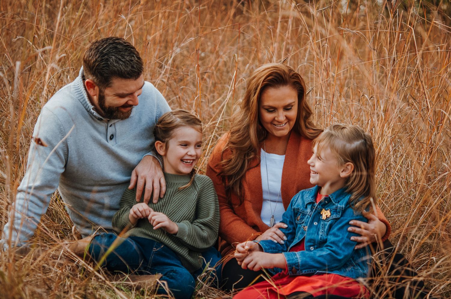 Family Playing in park in the fall
