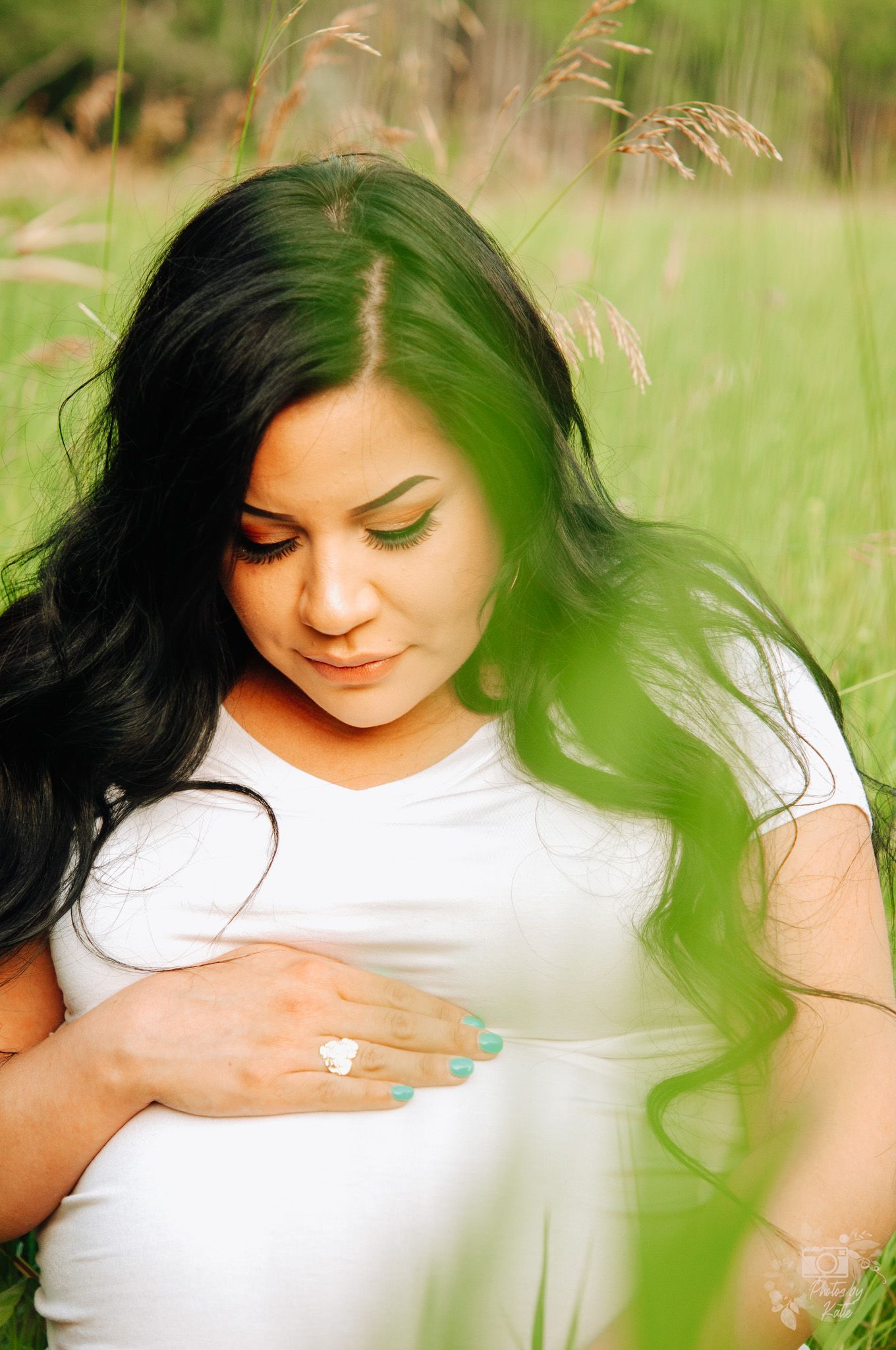 Pregnant woman holds belly