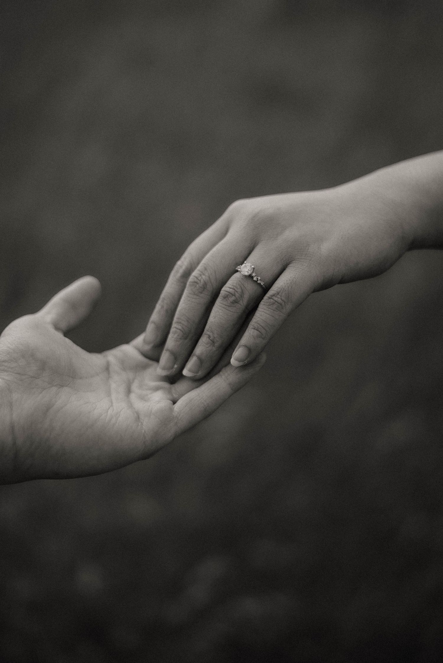 man holds womans hand