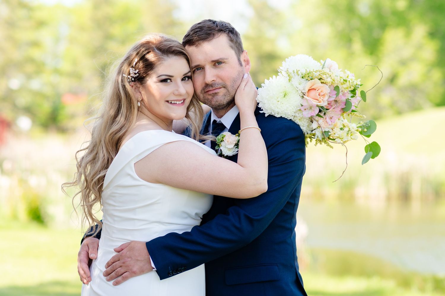 Couple look at camera on wedding day