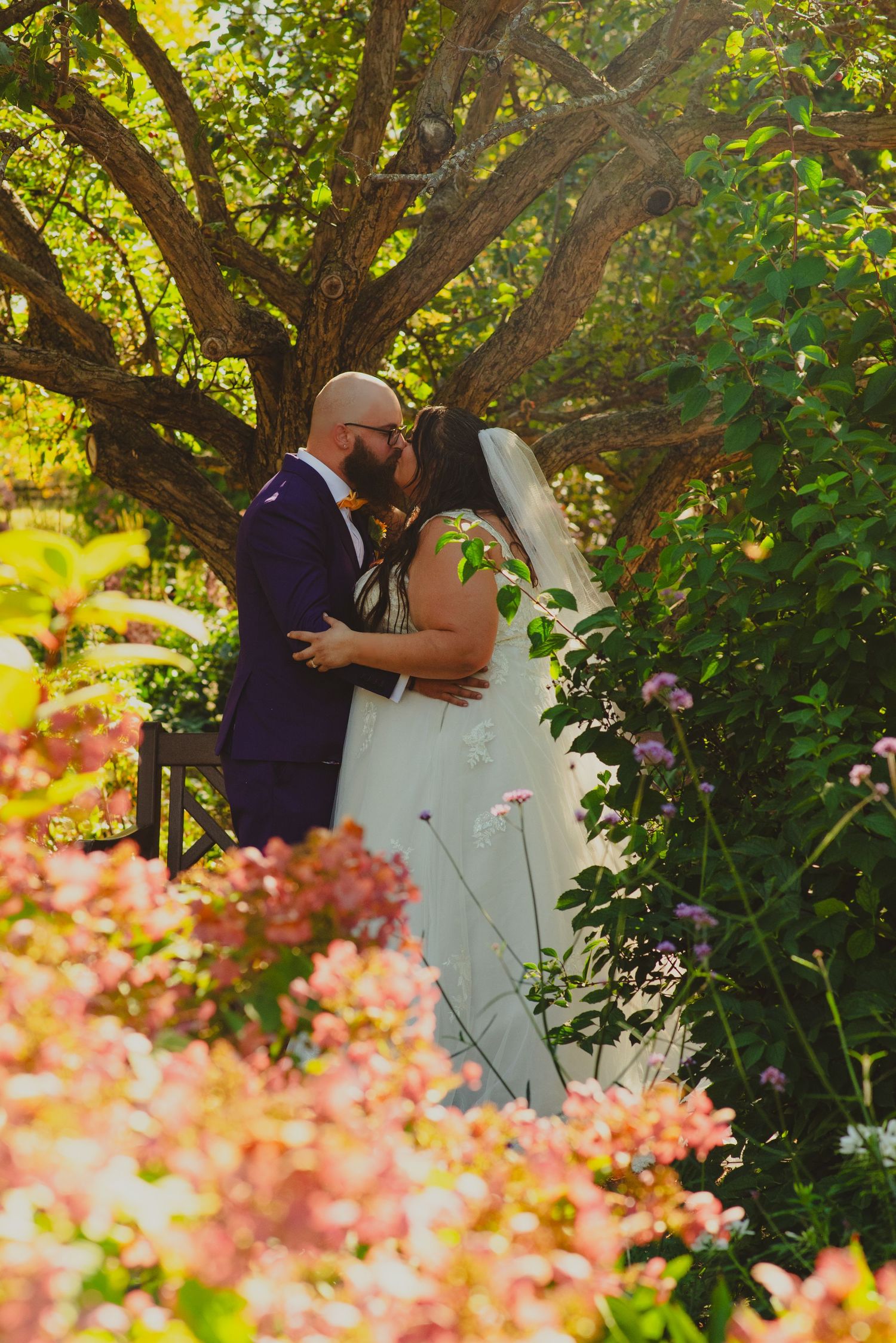 Couple kiss in flower garden