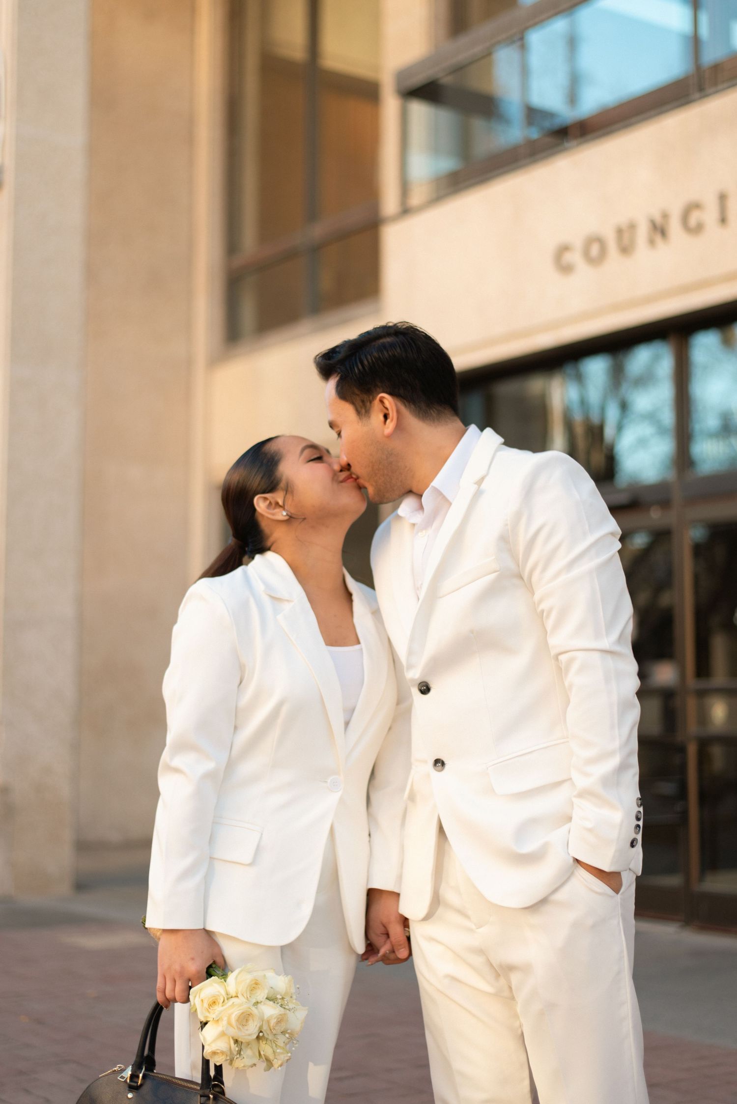 couple kiss outside city hall