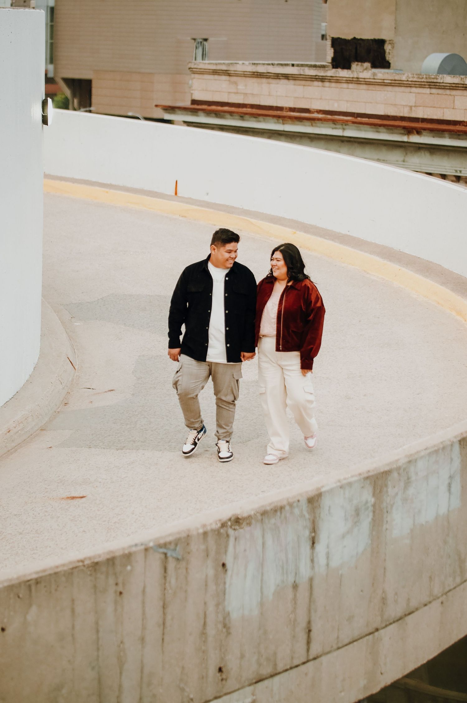 Couple walking down parkade ramp