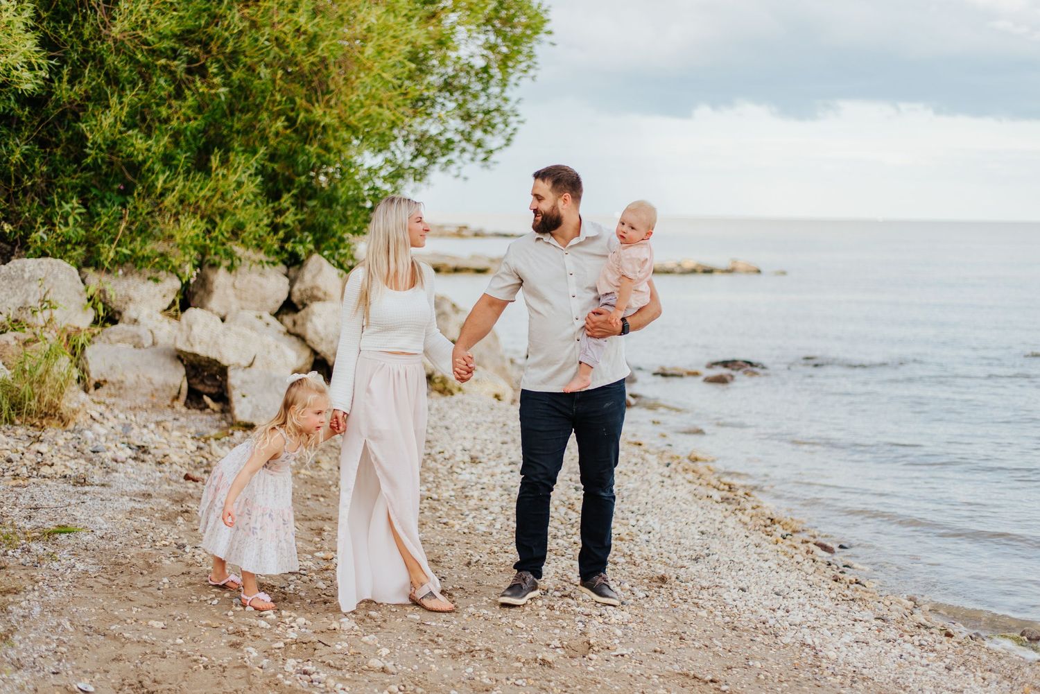 Family walks along beach