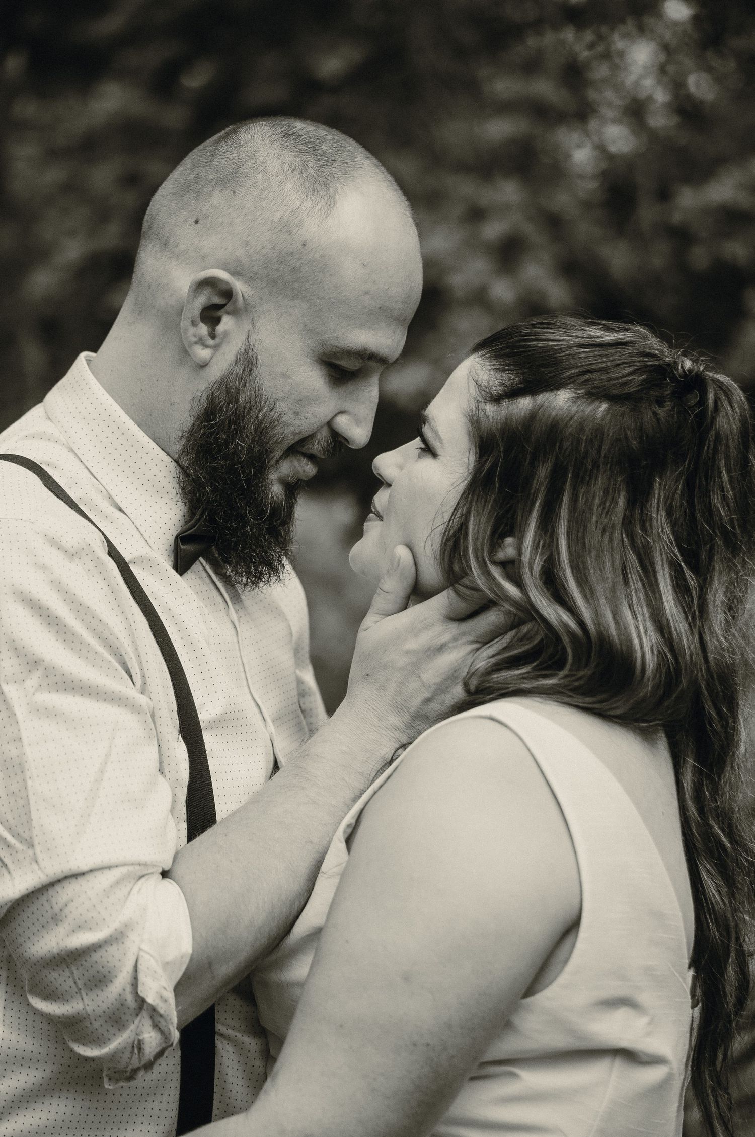 Couple lean in for kiss on wedding day