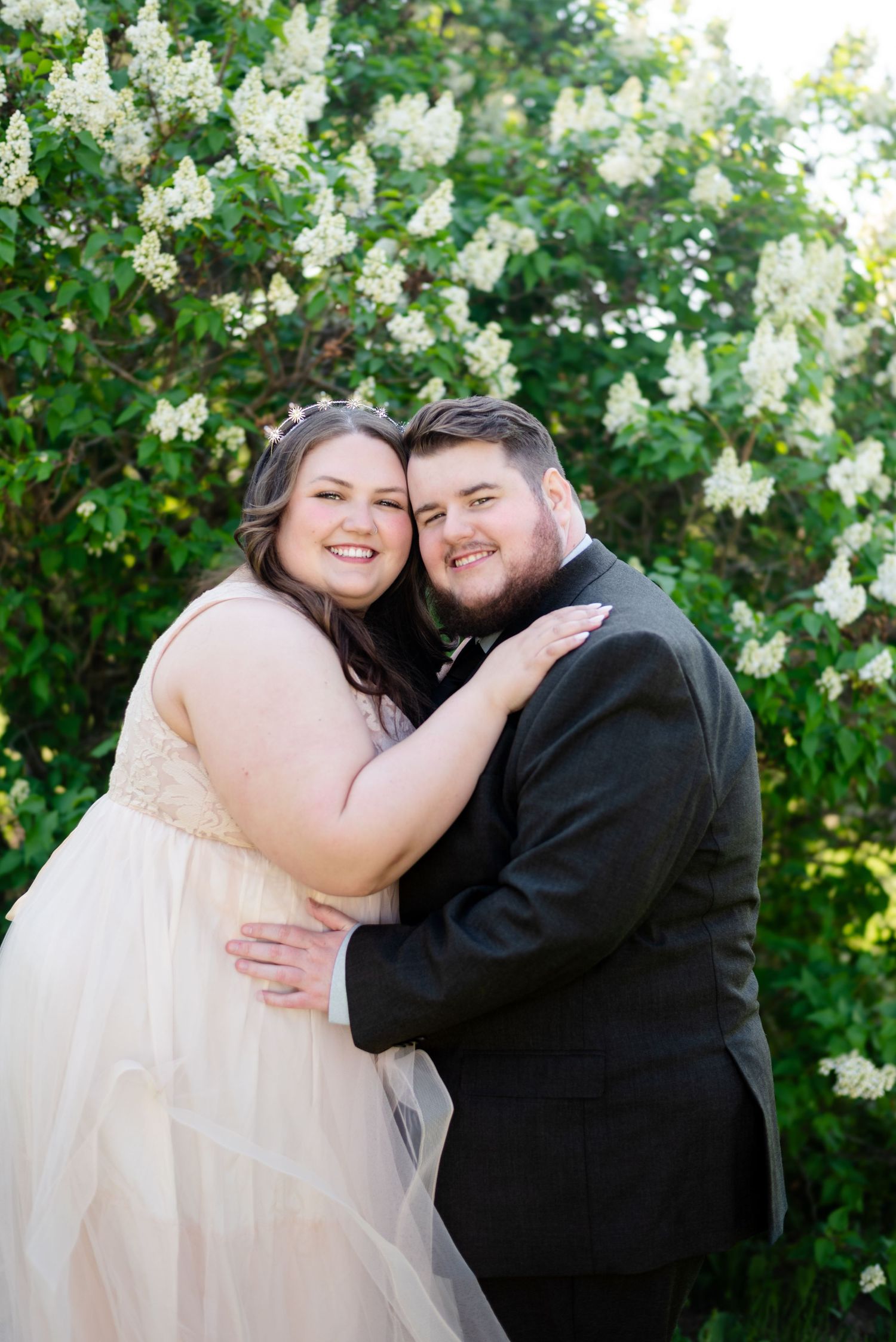 Couple looks at camera for wedding portrait