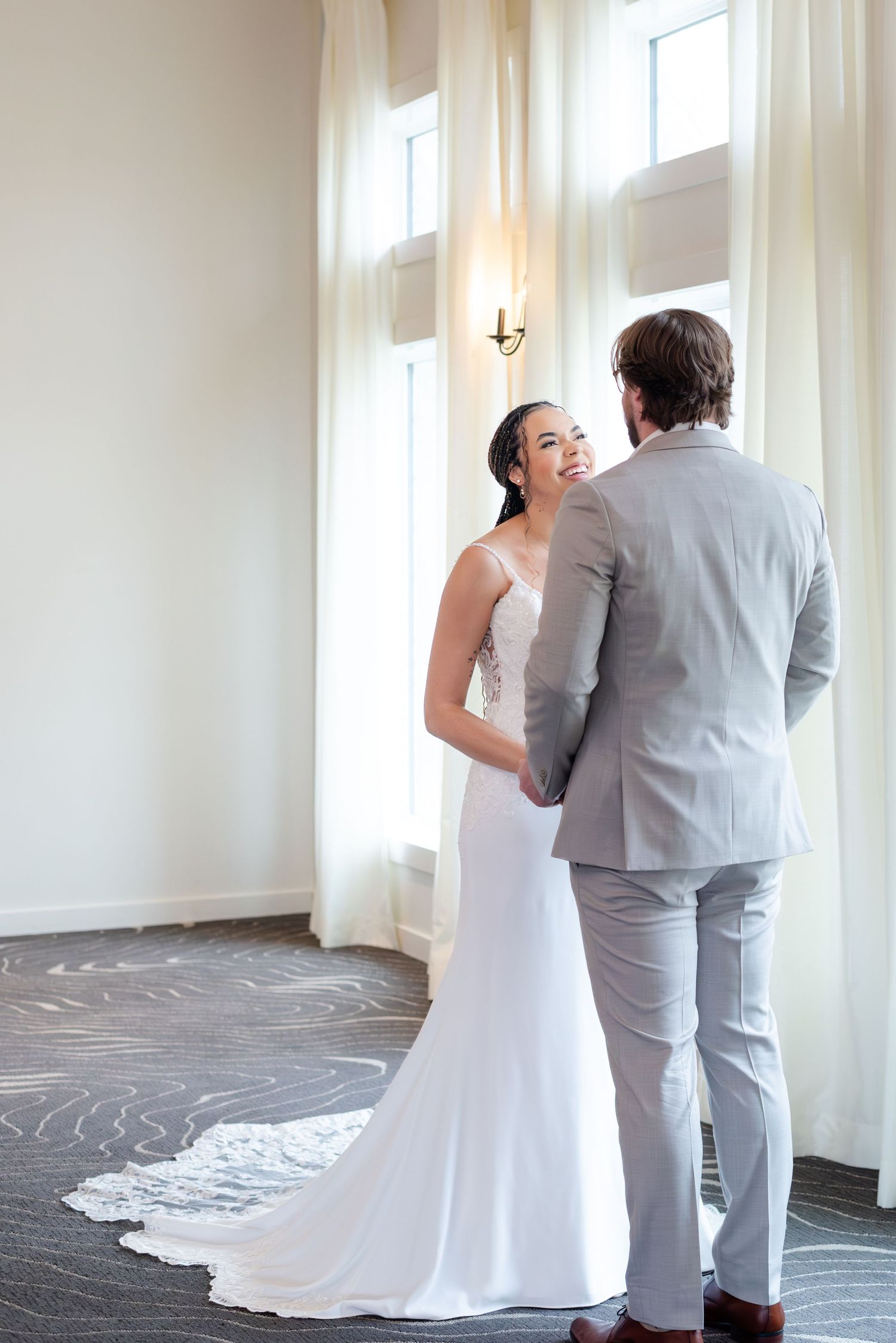 Bride smiles at groom