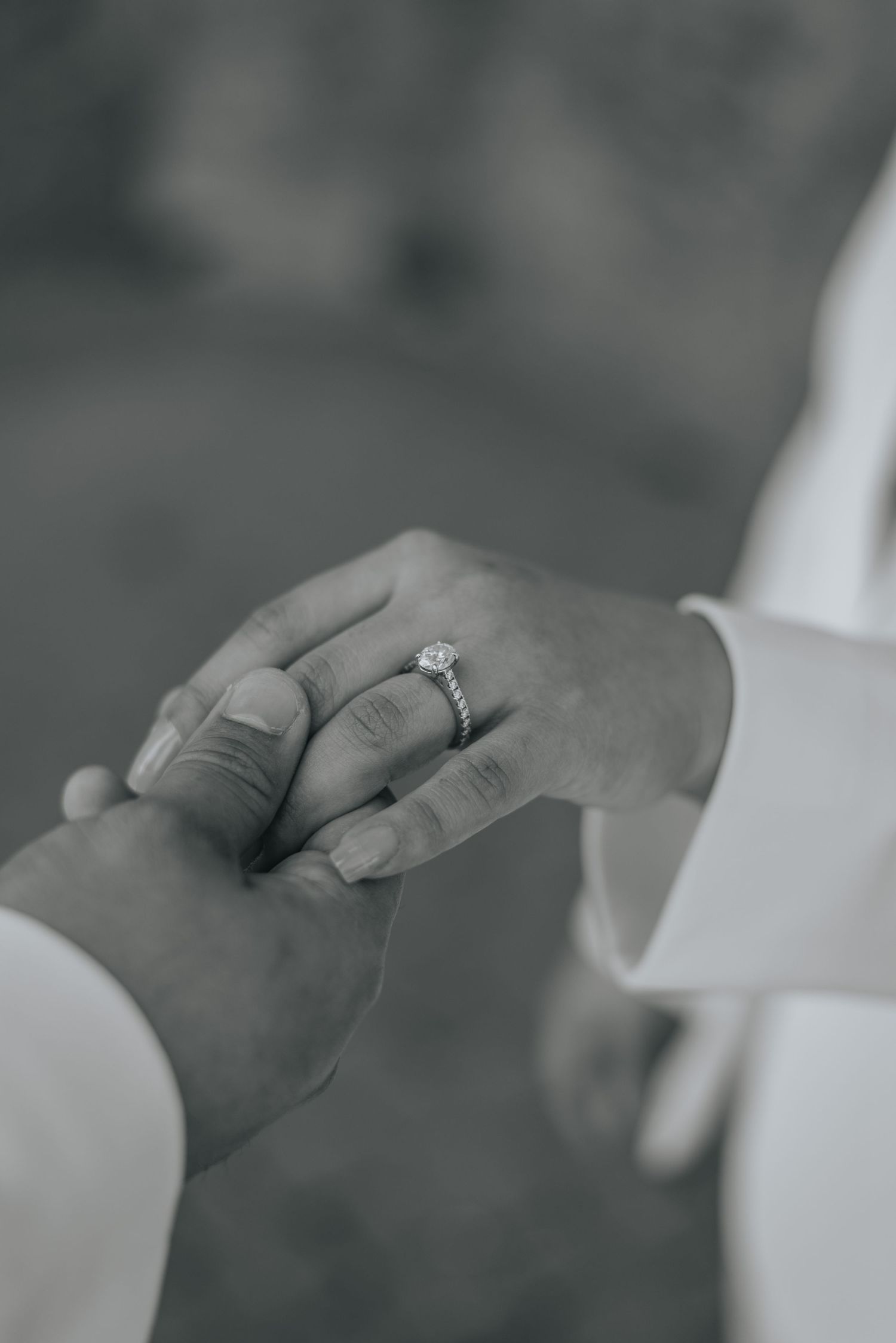 Man holds womans hand