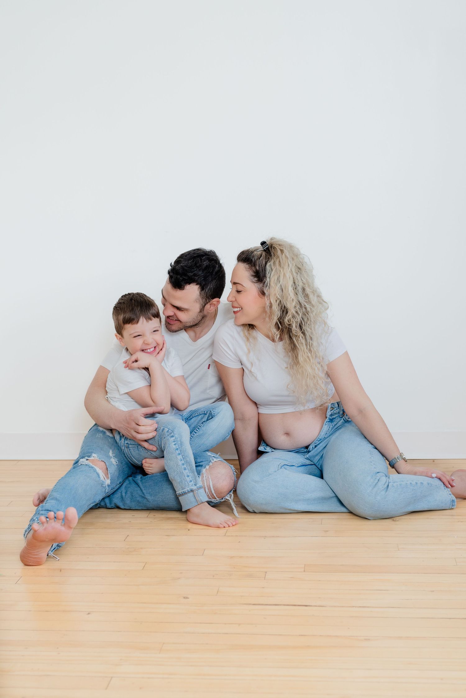 couple cuddle in studio photoshoot
