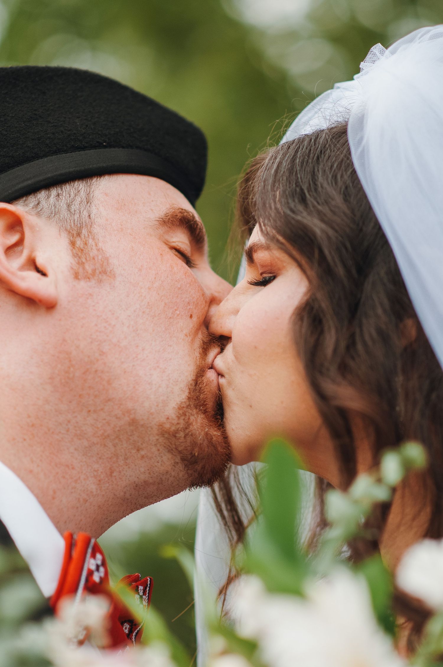 couple kiss on wedding day