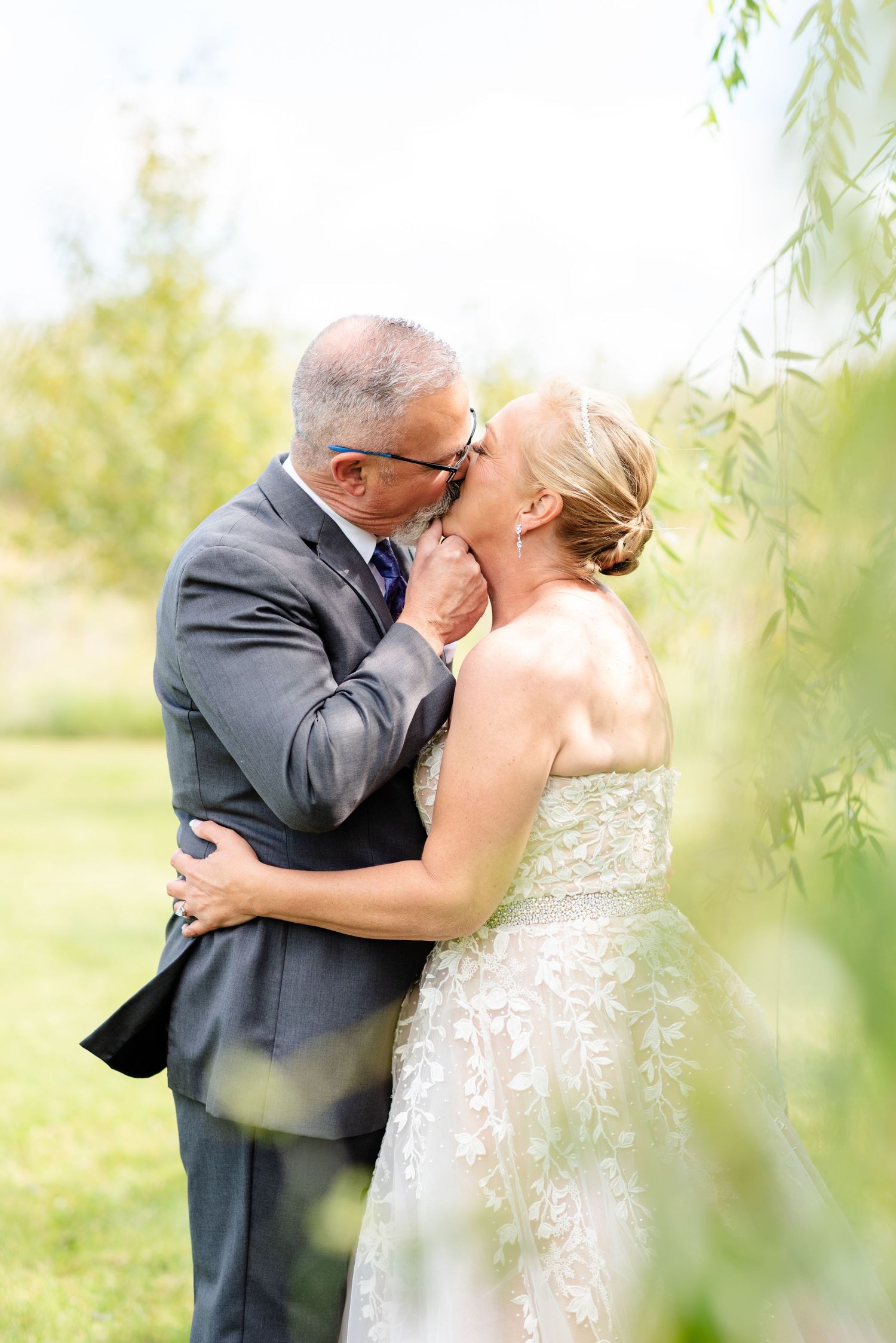 bride and groom kiss