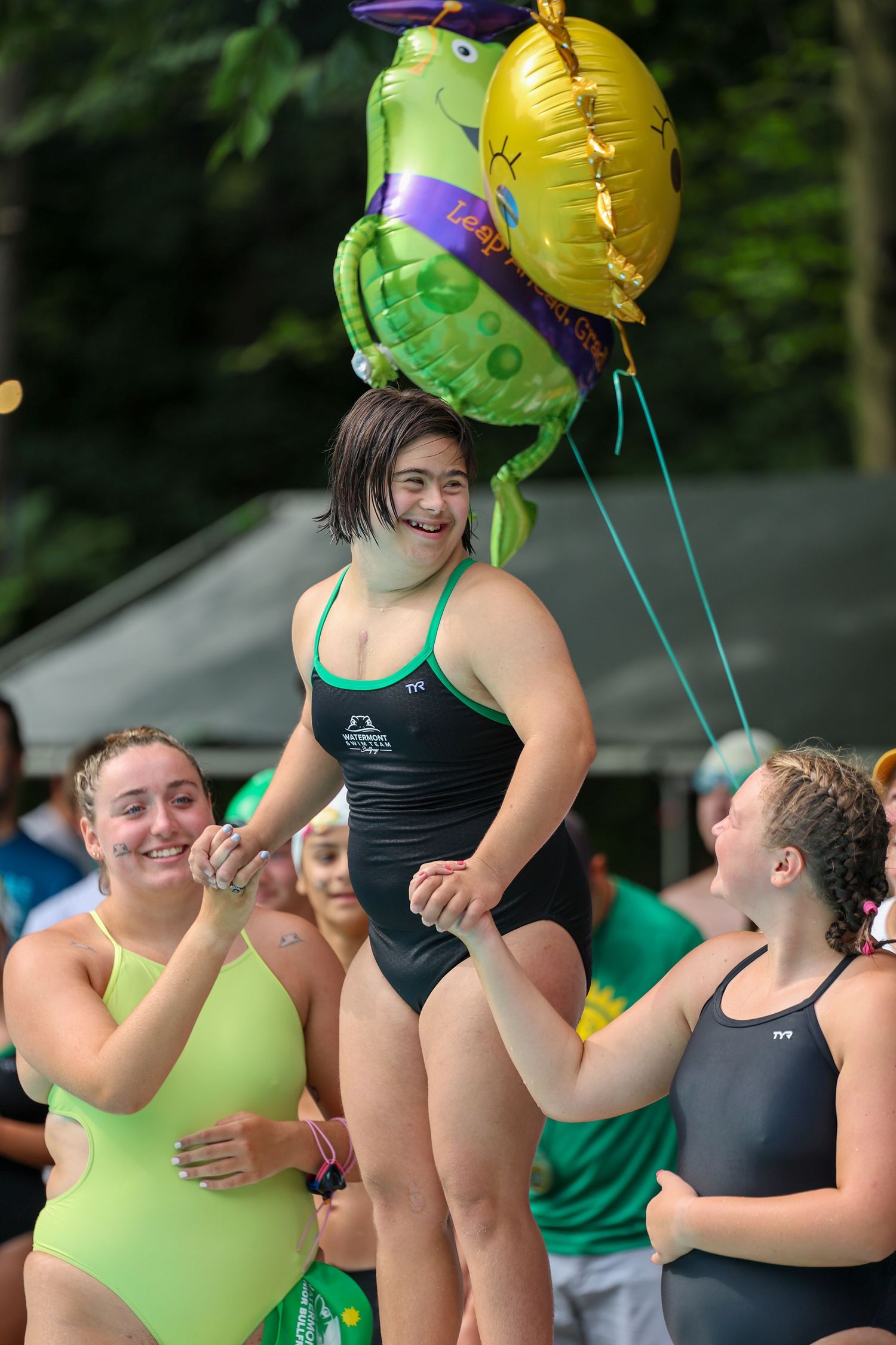 Swimmer being recognized at a senior celebration.