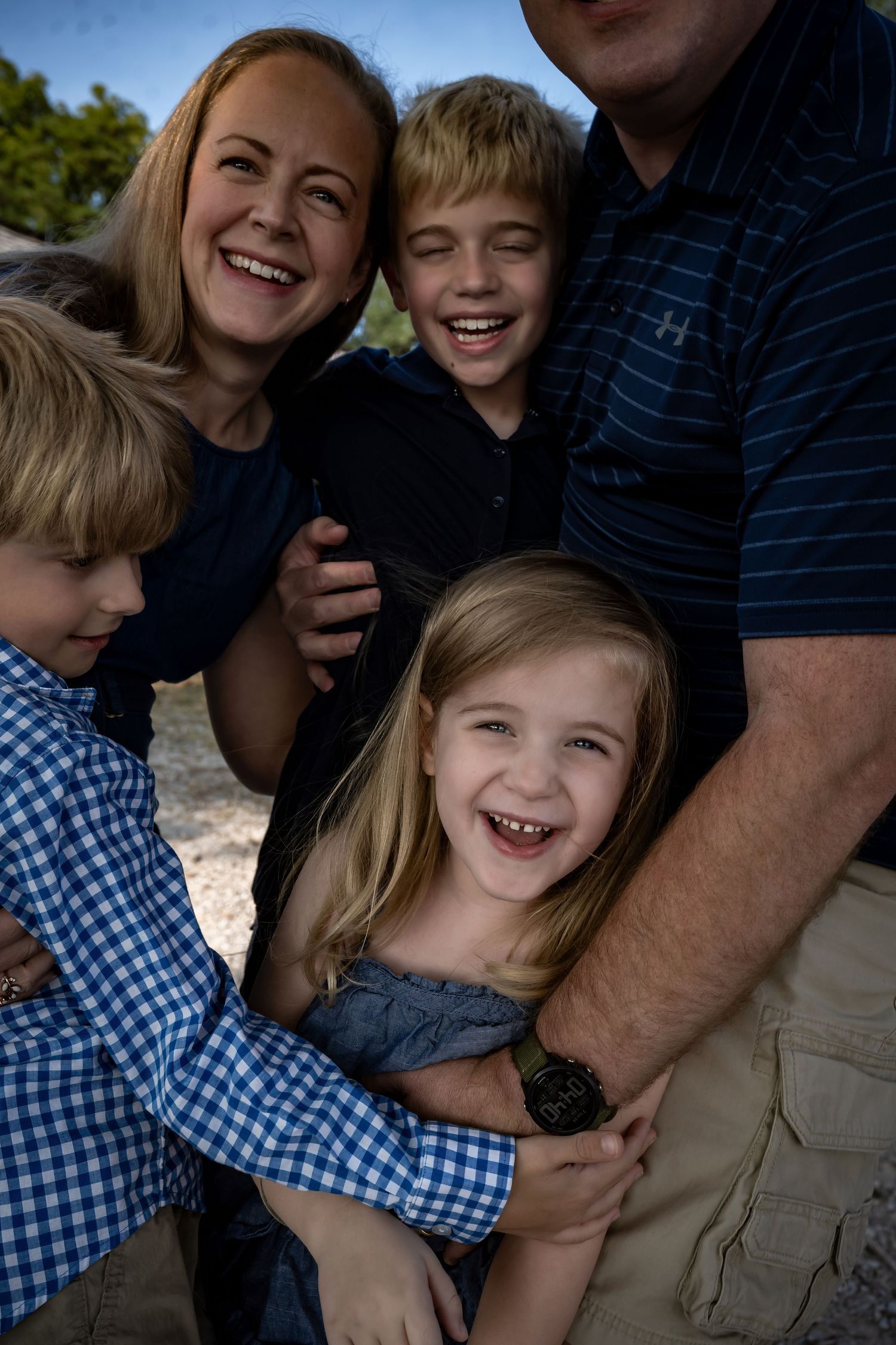 Happy family sharing a joyful moment together outdoors.
