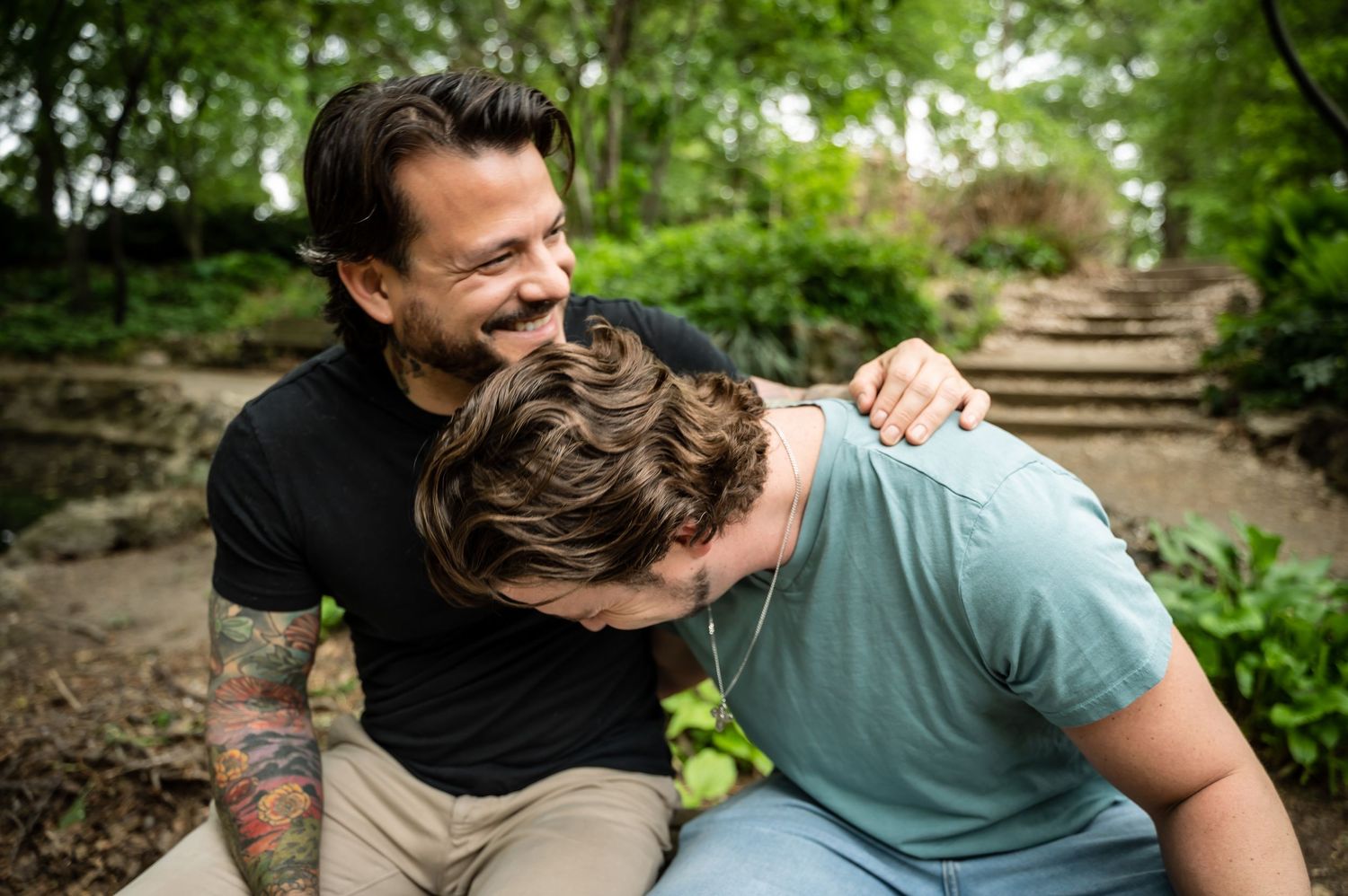 Candid outdoor moments captured in a lush green garden setting.