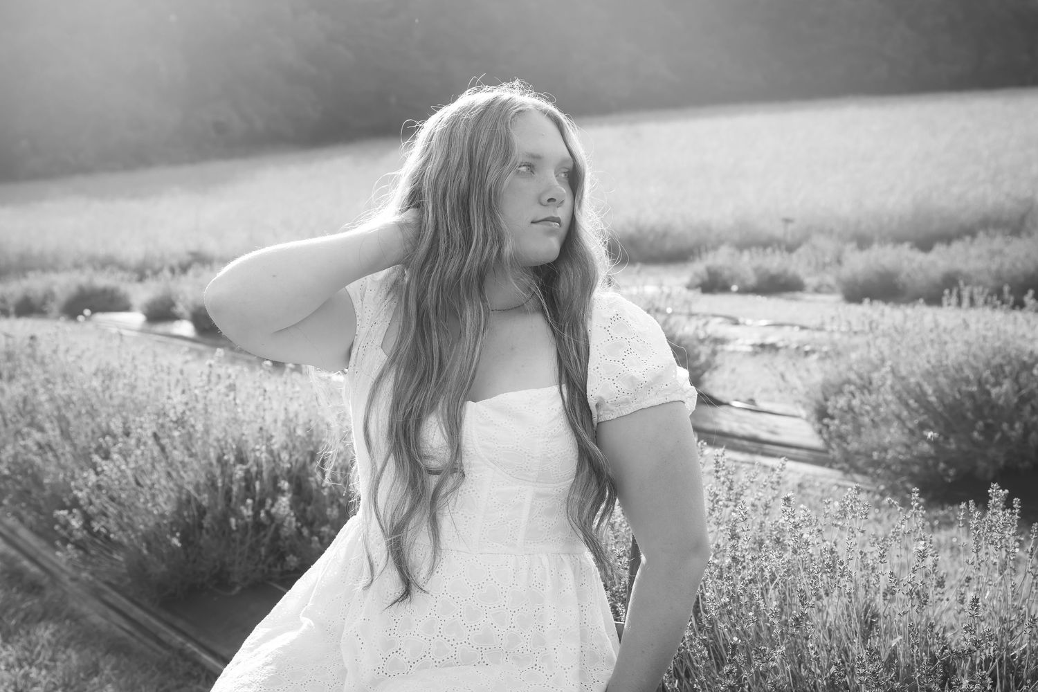 Black and white portrait series in a dreamy summer field.