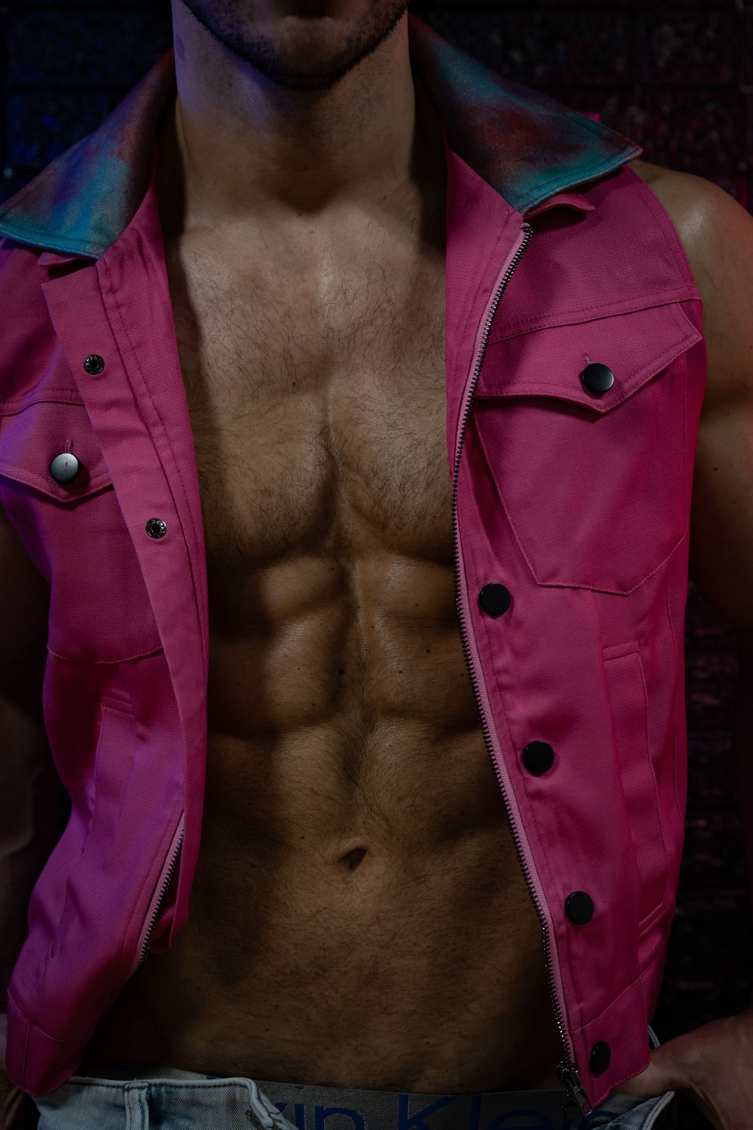 Artistic fashion photo series showing pink jacket against dark background with dramatic lighting and contrast.