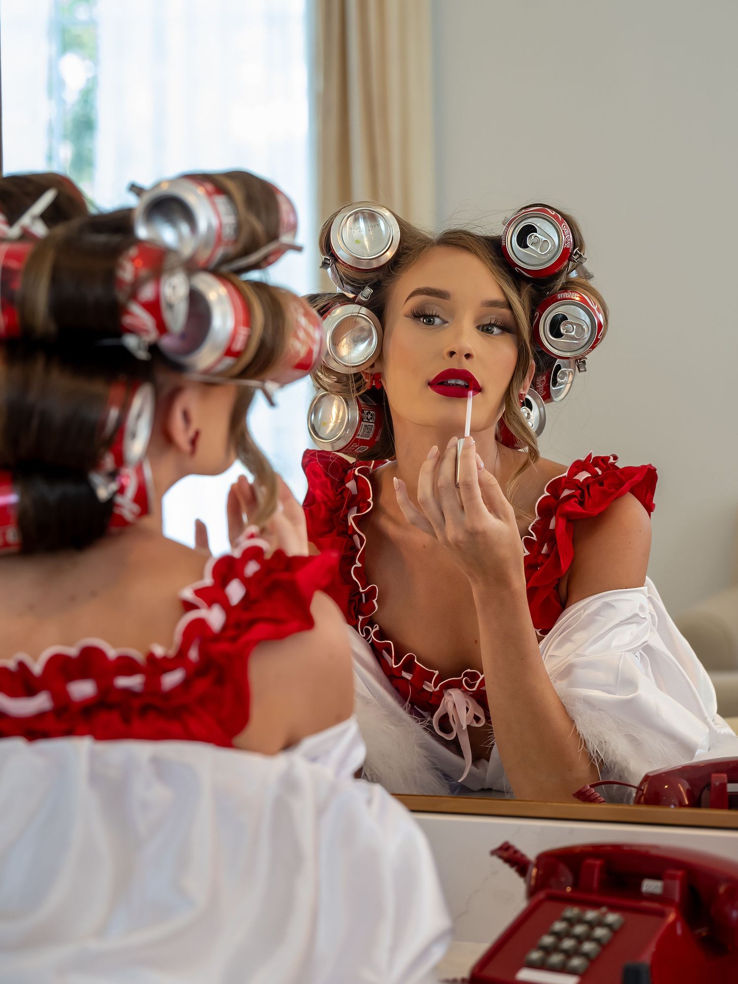 Vintage-inspired photoshoot with hair curlers and retro styling elements.