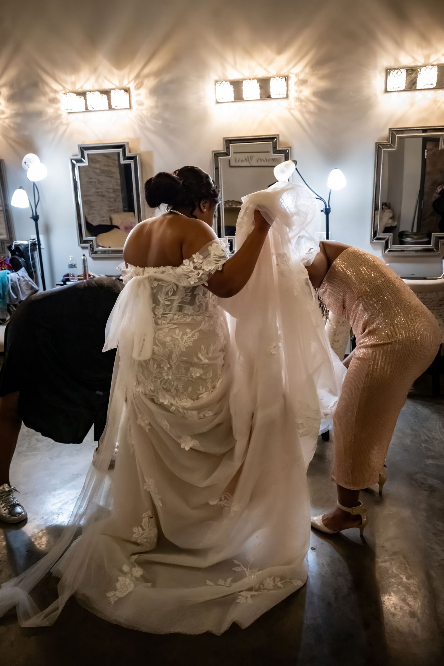 Wedding dress fittings and adjustments in a bridal boutique.