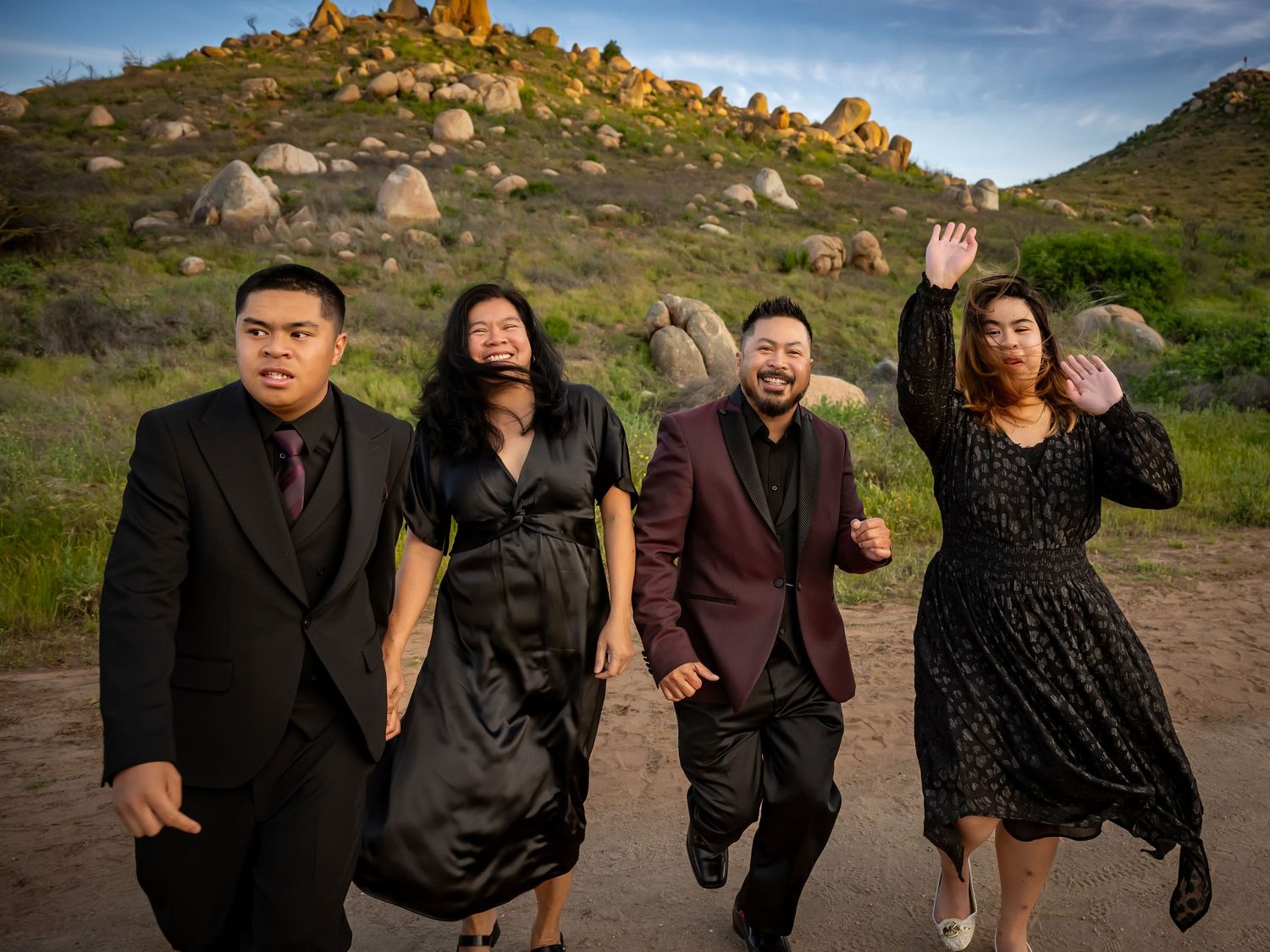 Candid group photos on mountain trail during sunset with dramatic sky.