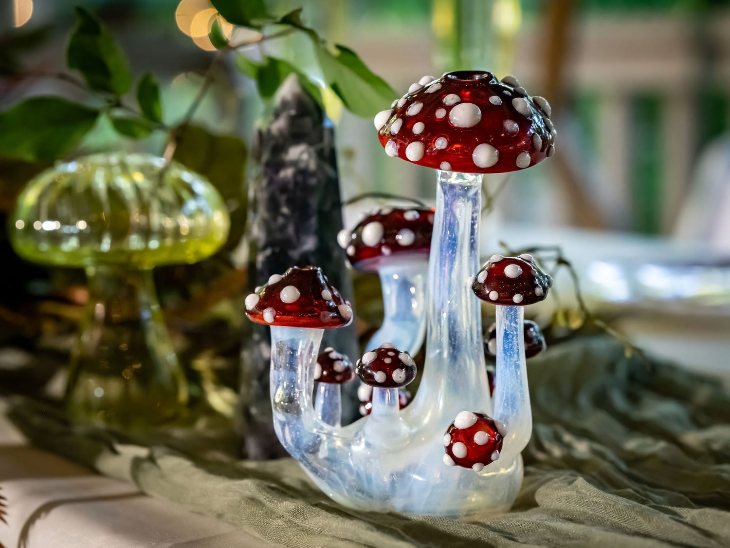 Red and white spotted mushroom decorations create a whimsical fairytale setting.