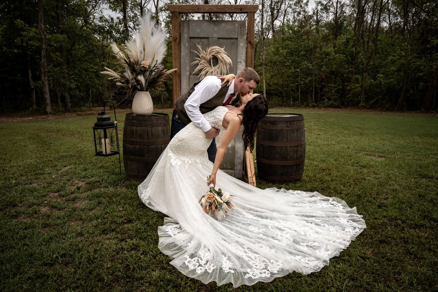 Romantic outdoor wedding portraits with white dress against natural wooded backdrop.