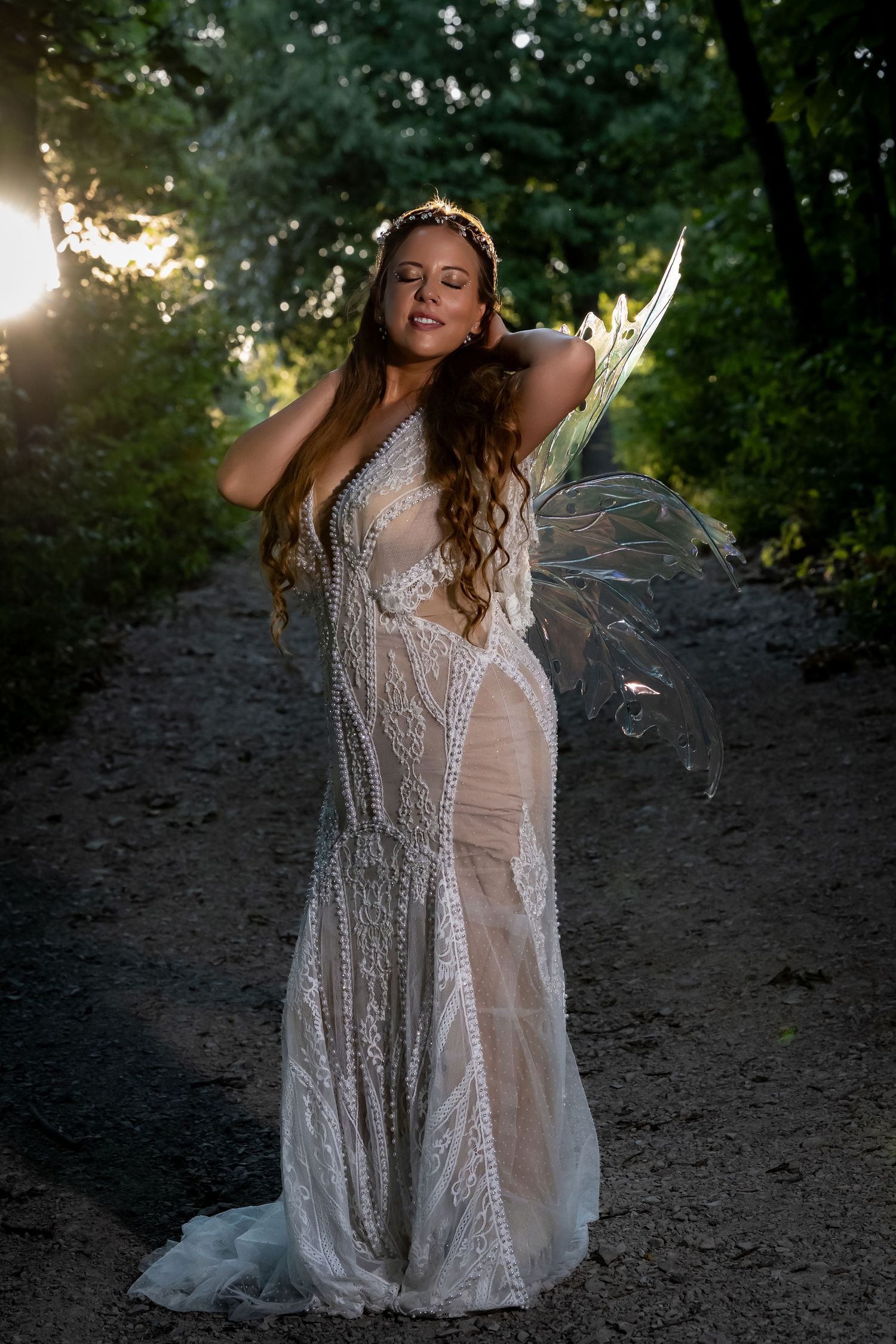 Ethereal bridal portraits at sunset with backlit lace dress details.